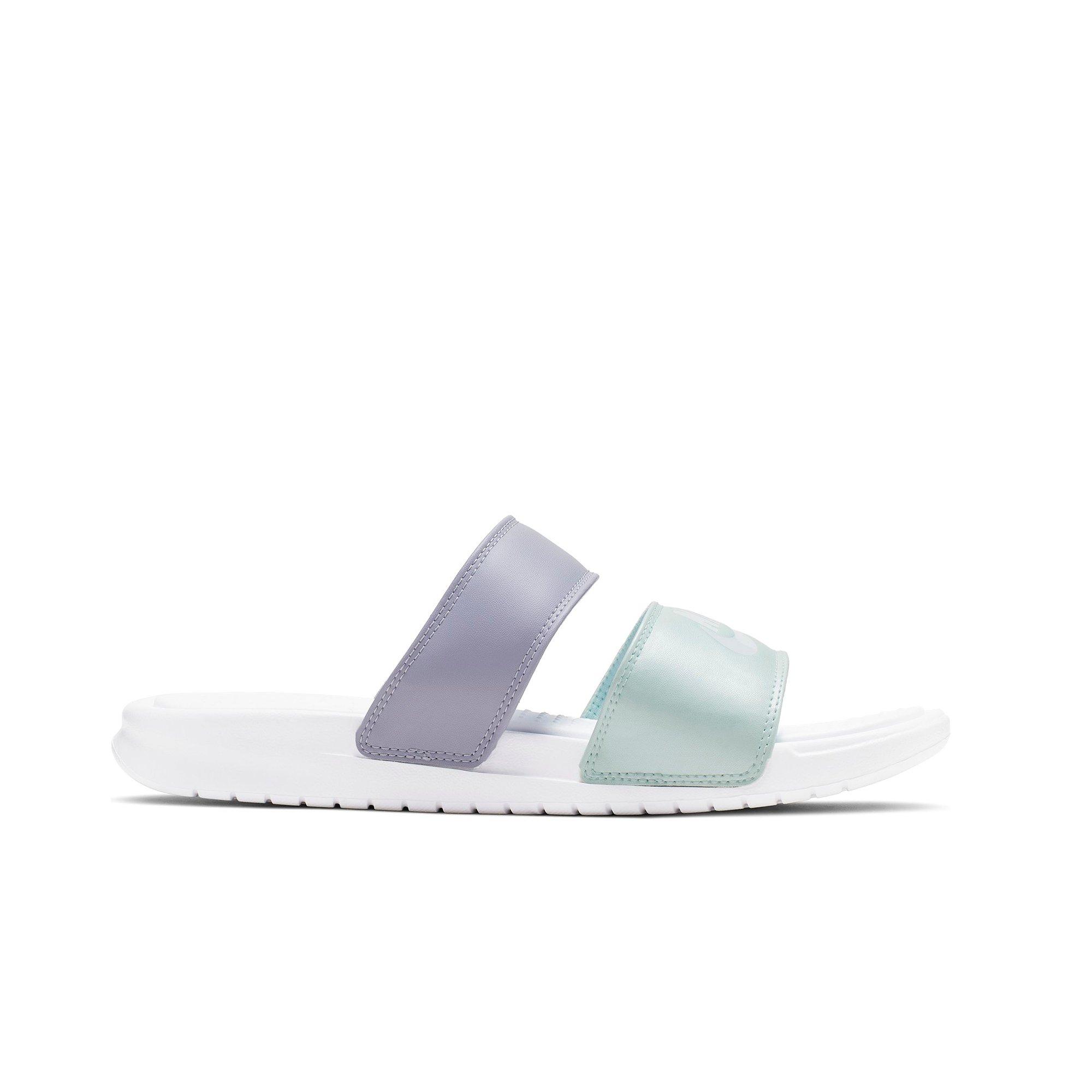 teal and white nike slides