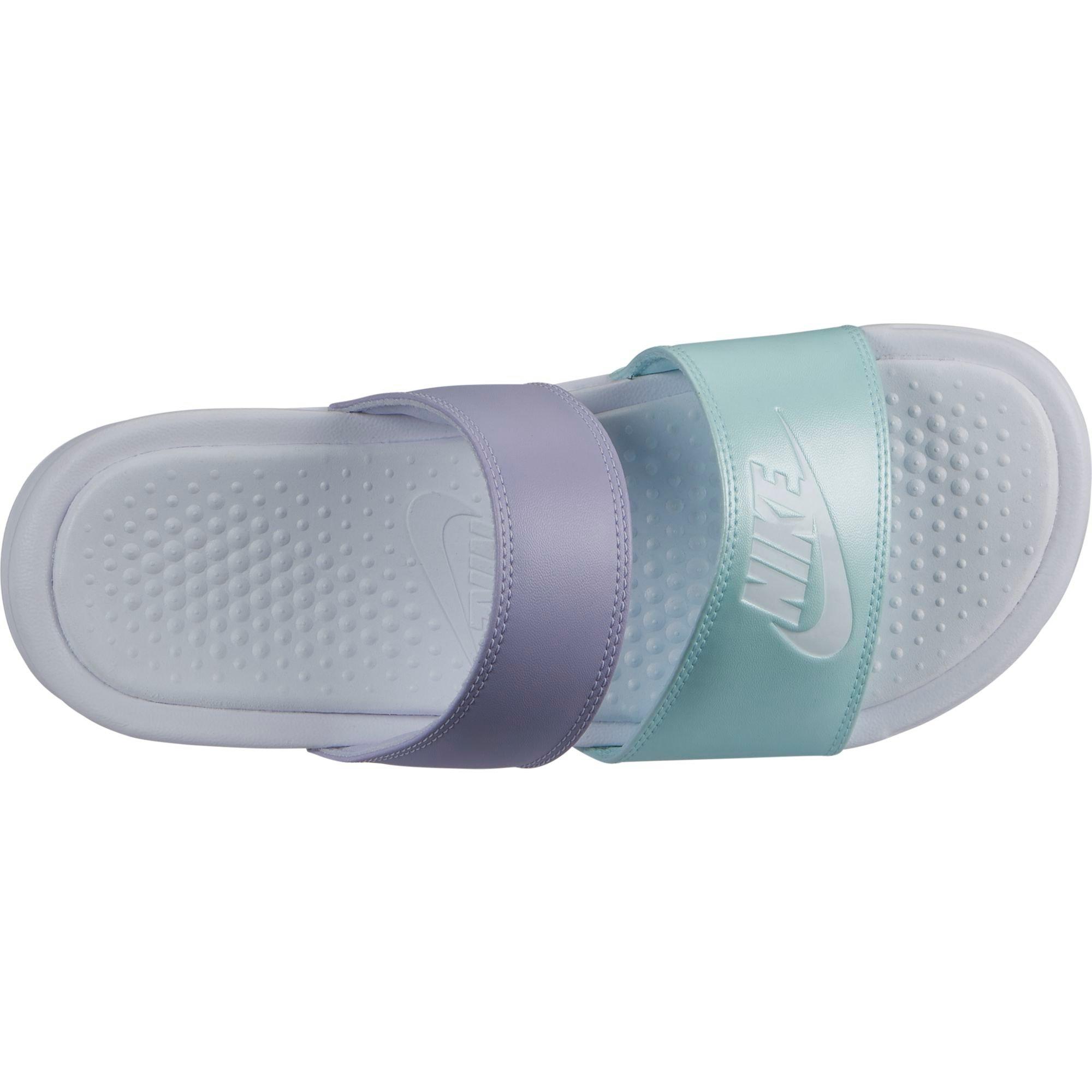 teal and white nike slides