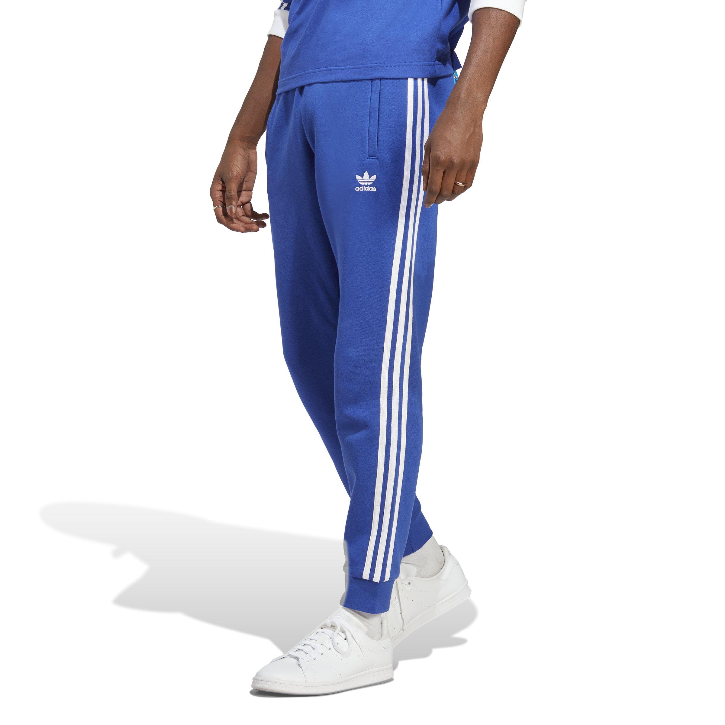 White adidas pants shop with blue stripes