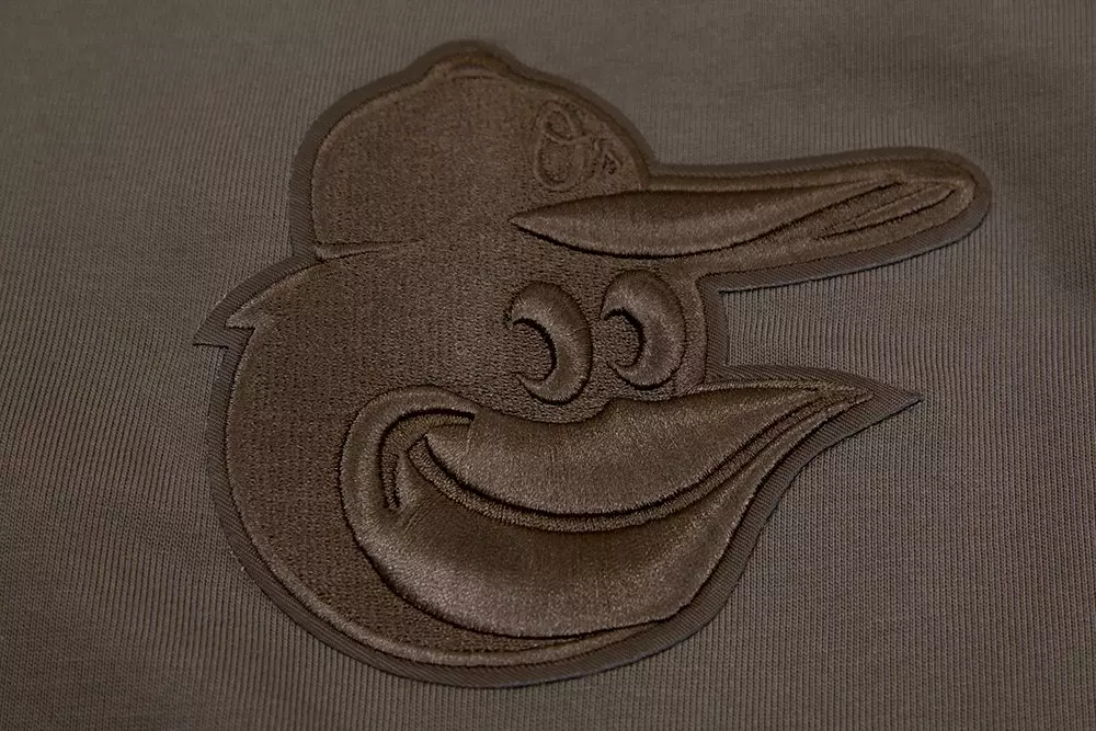 Pro Standard Men's MLB Baltimore Orioles Neutral Drop Shoulder Top - DK BROWN