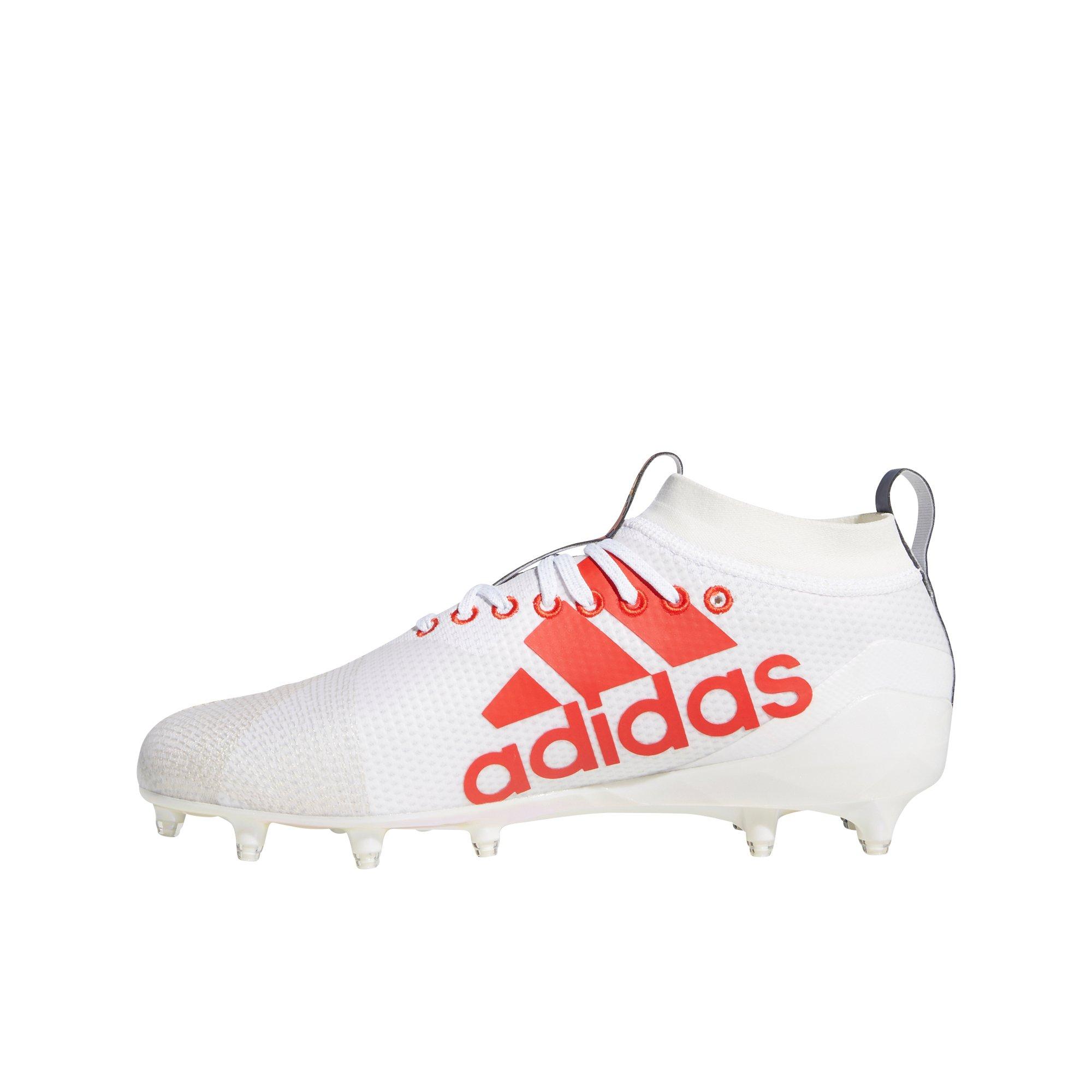 white and red football cleats