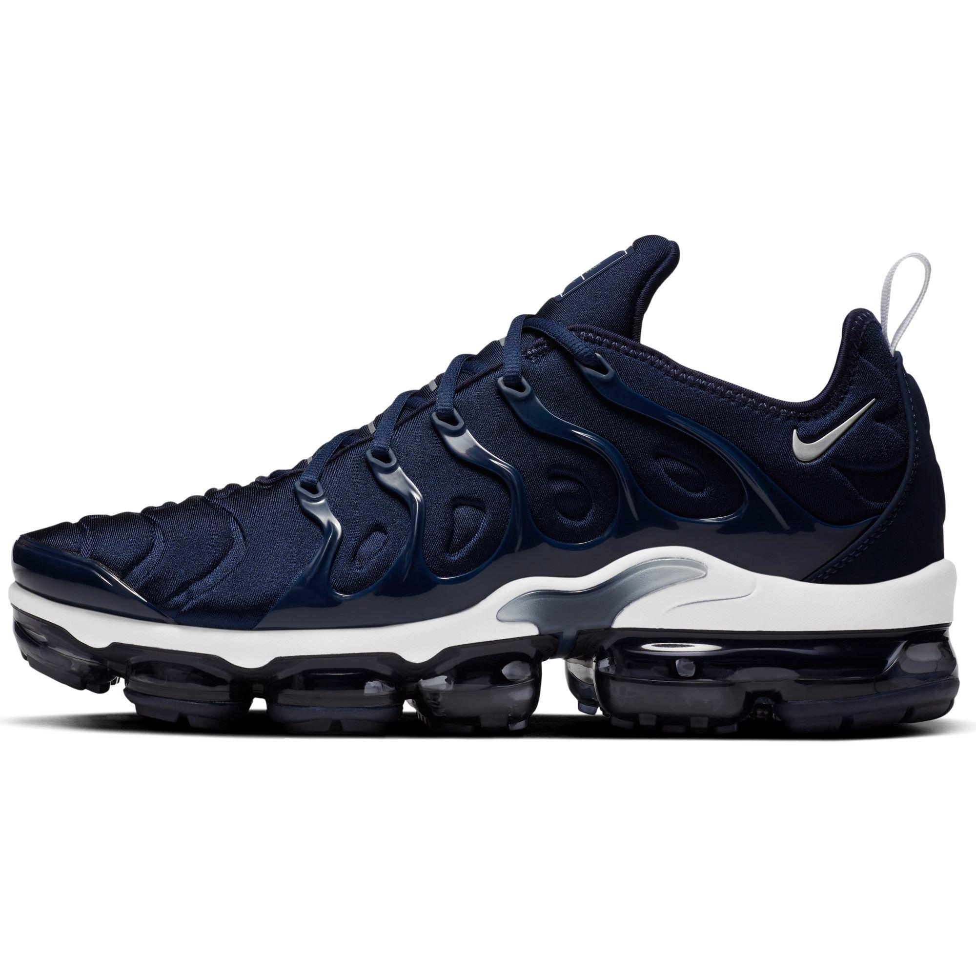 navy blue and white vapormax