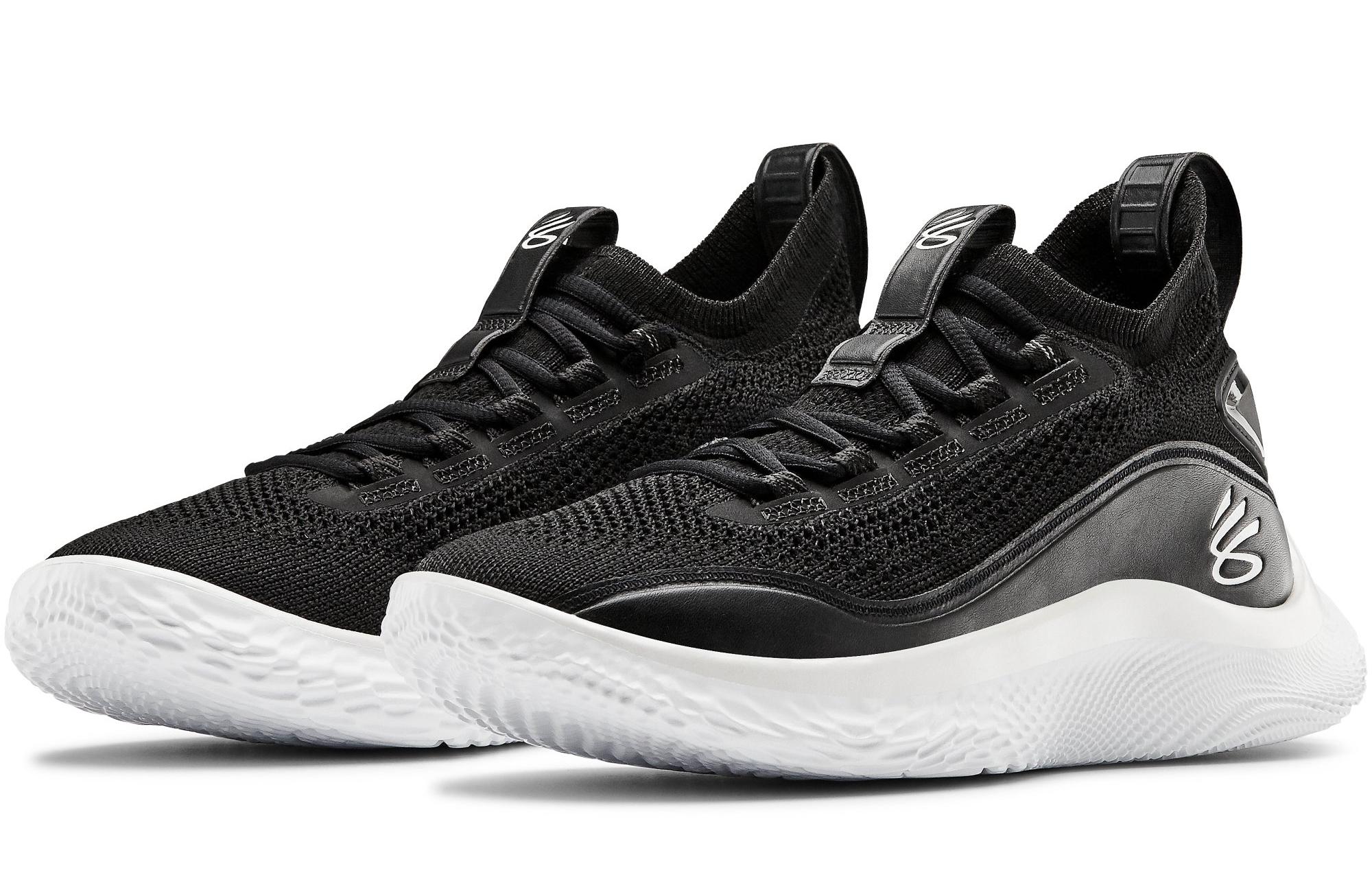 white and black curry shoes