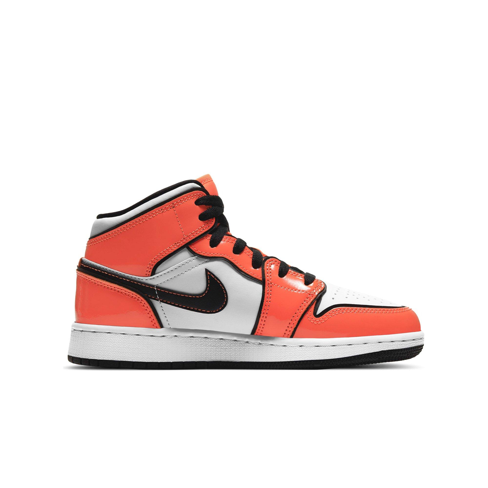 orange white and black jordan 1 grade school