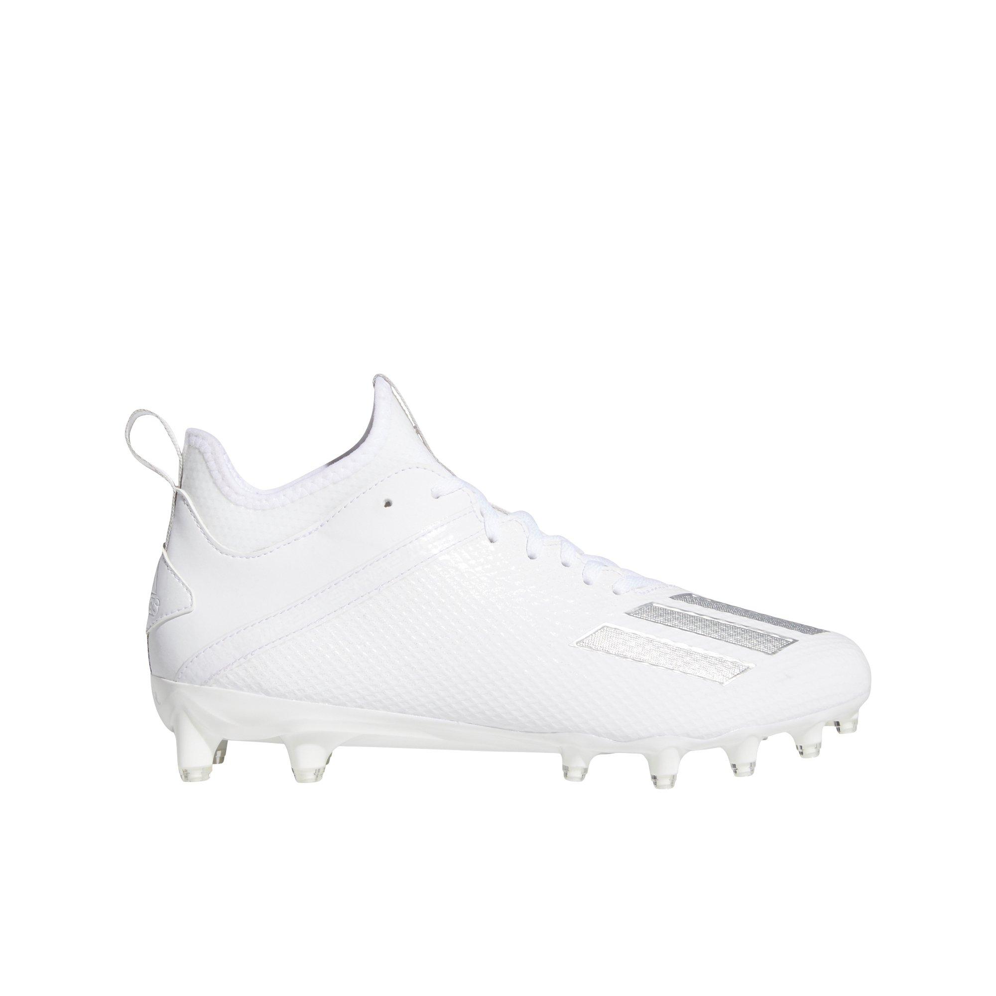 white and black adidas cleats