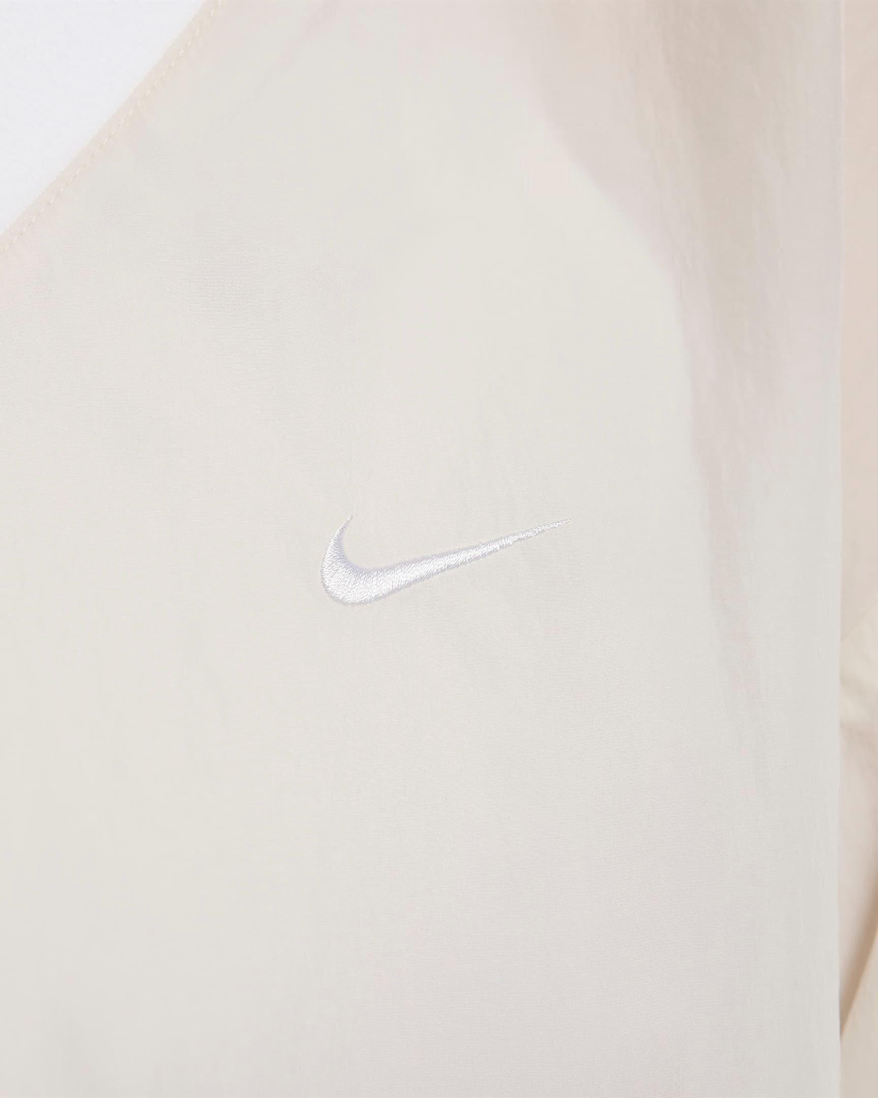 Nike Women's Sportswear Essential Loose UV Woven Long Sleeve V-Neck Top - BROWN Thumbnail View 4