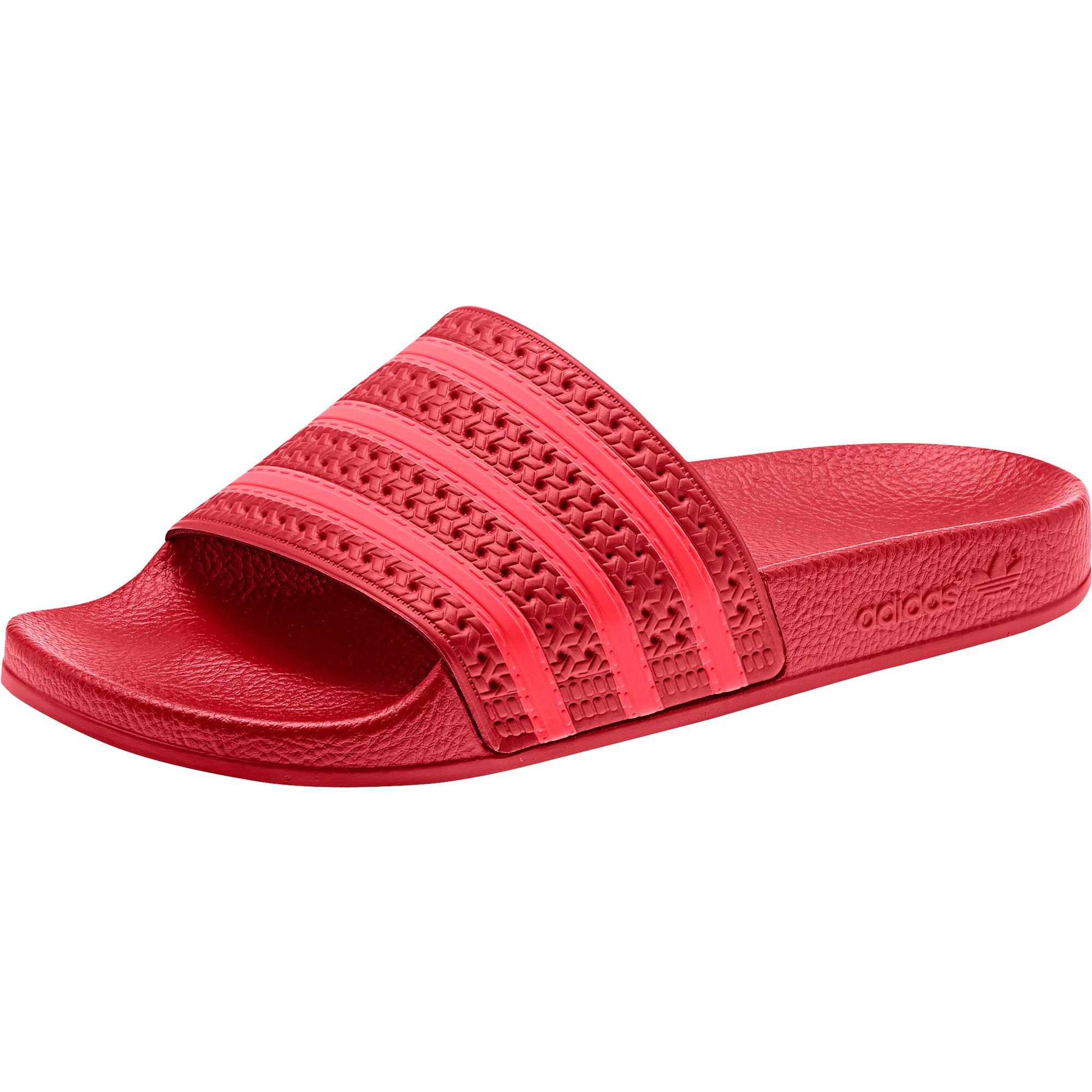 red and pink adidas slides