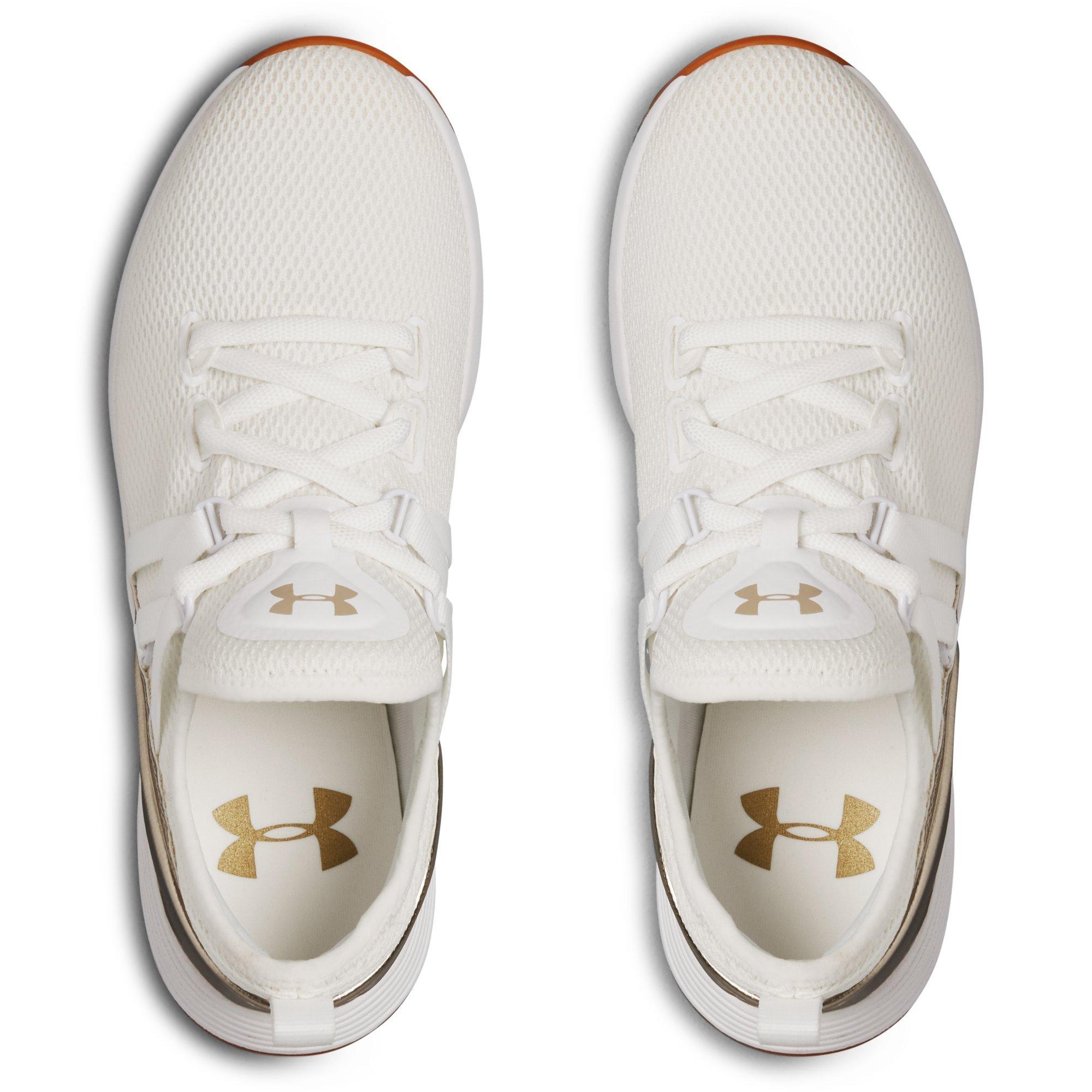 gold and white under armour shoes