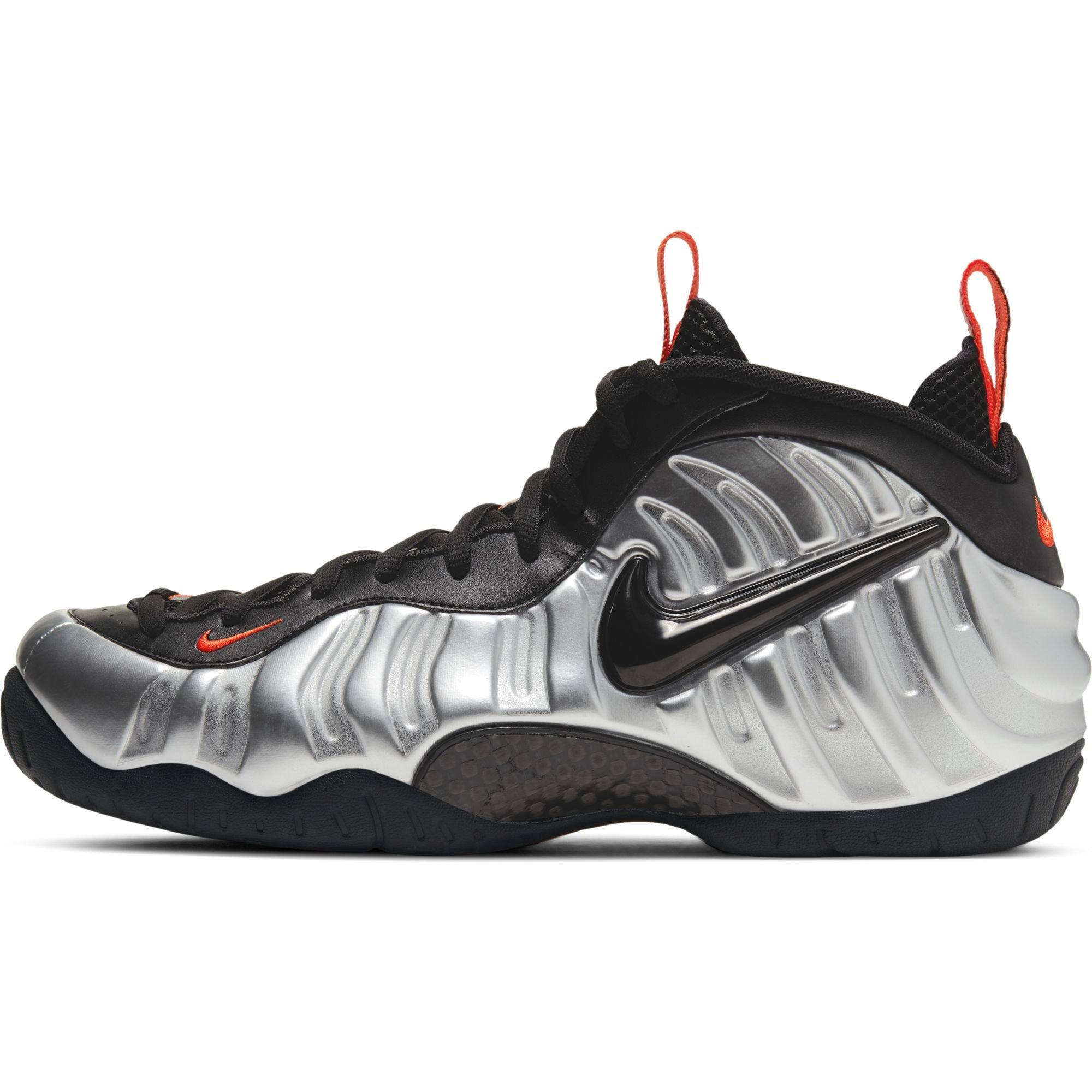 silver black and orange foamposites