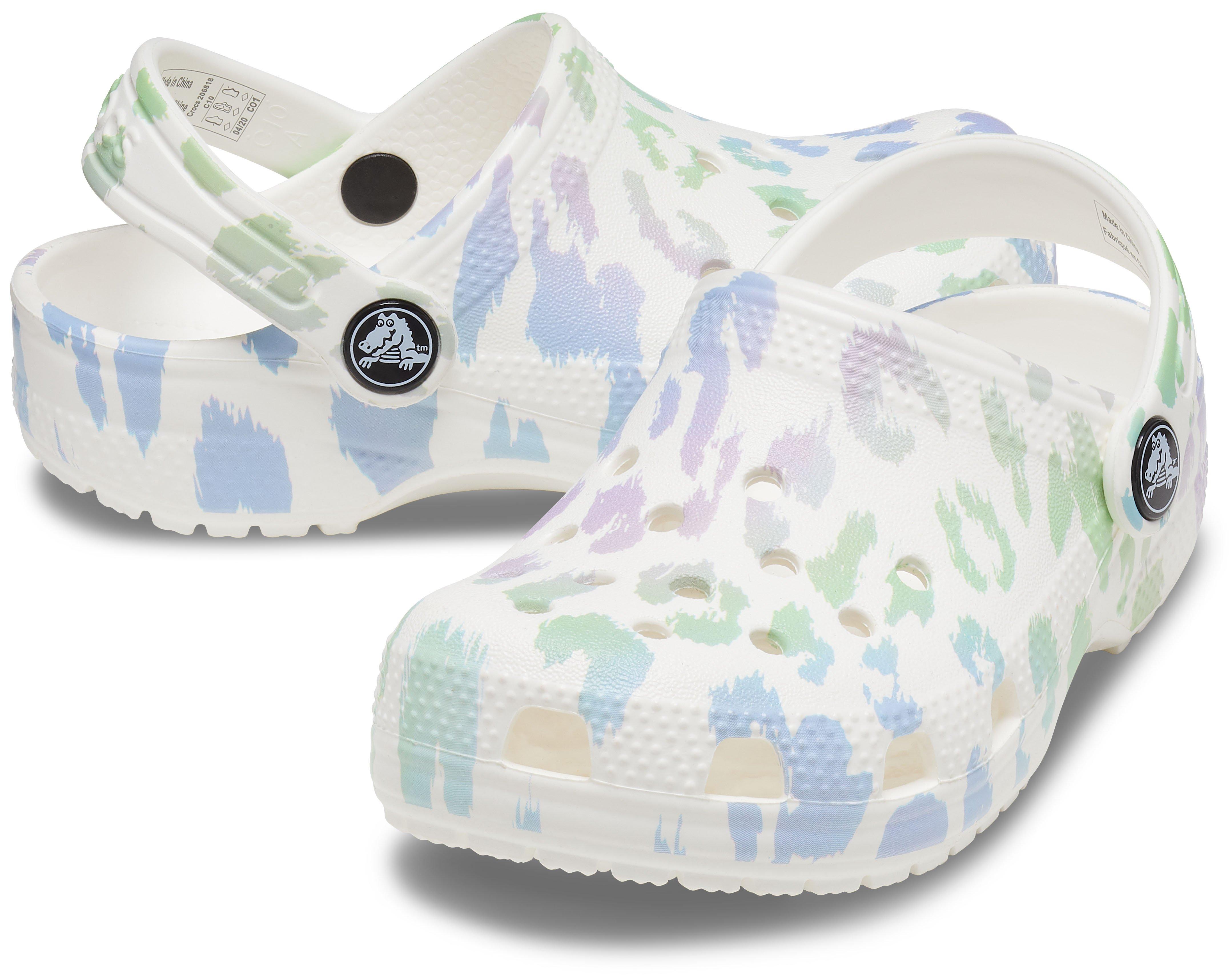 white and leopard crocs