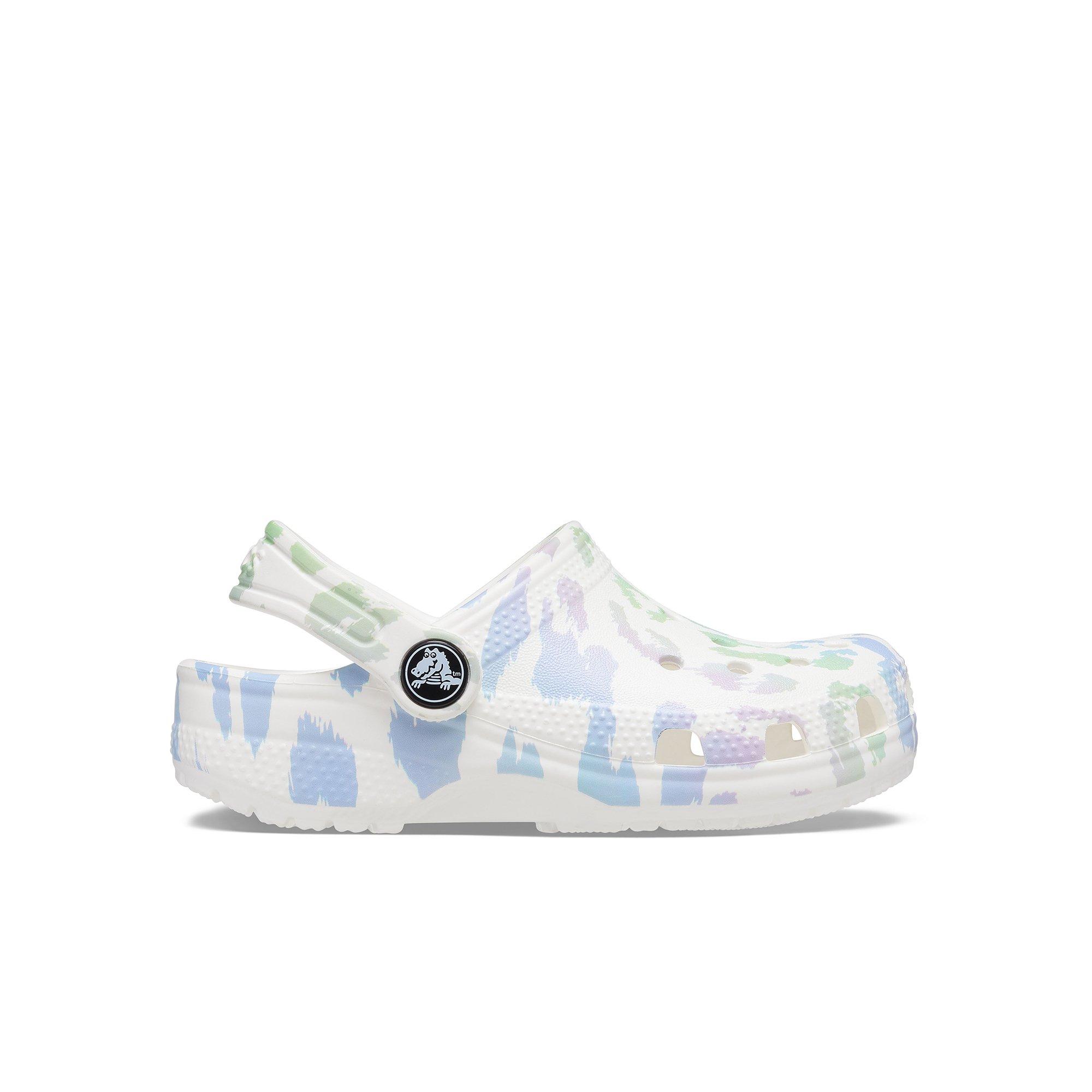 white and leopard crocs