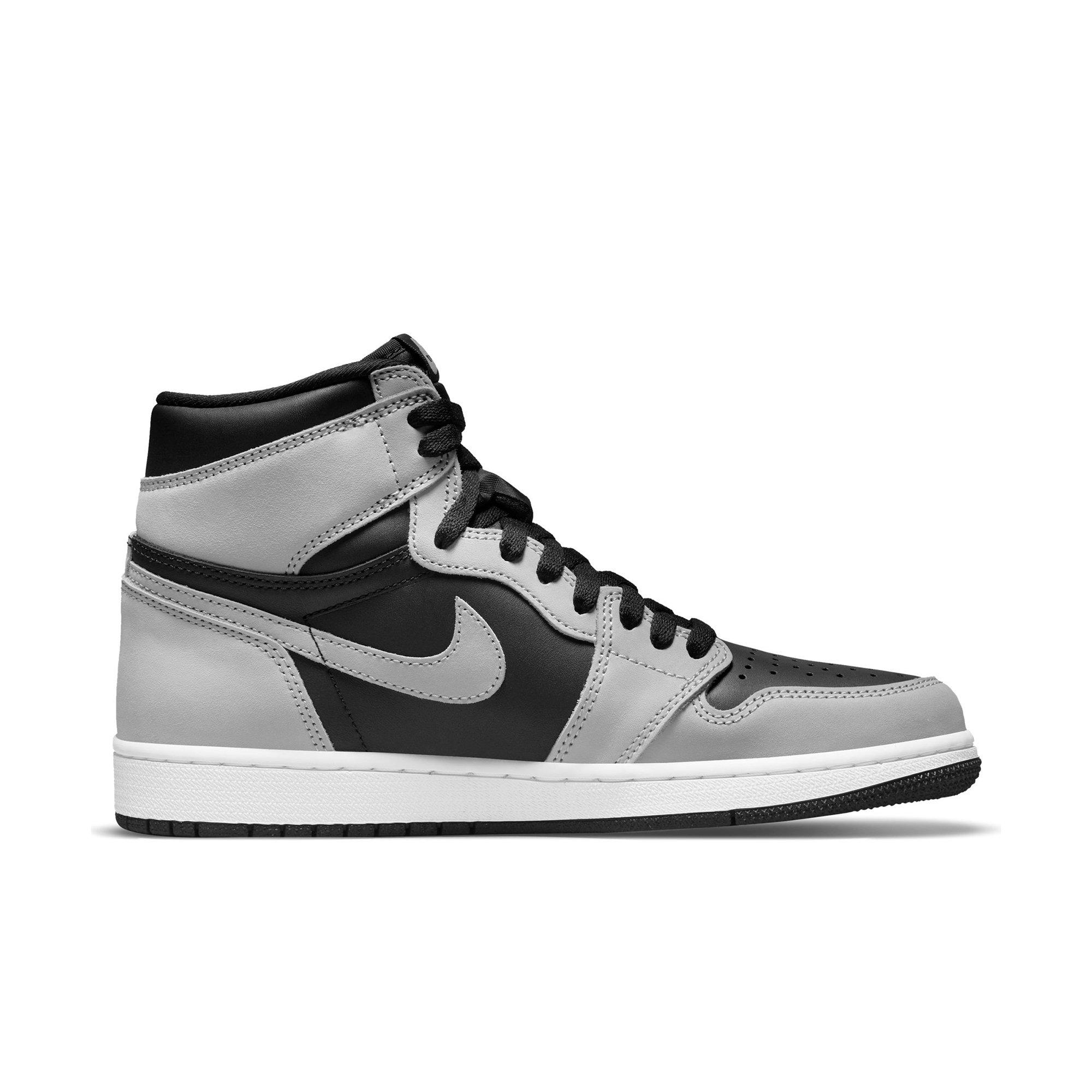 grey and black high top jordans