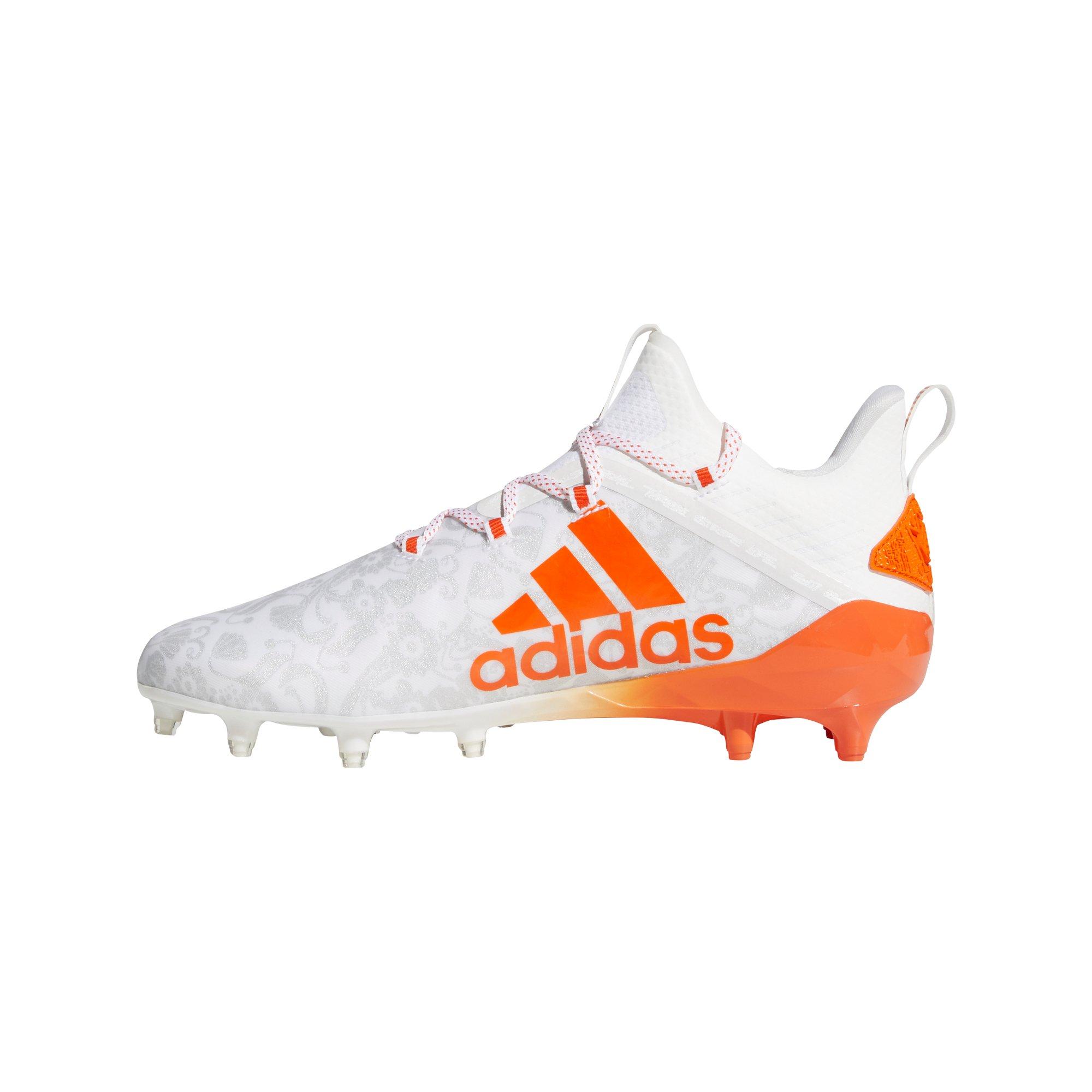 orange and white adidas football cleats