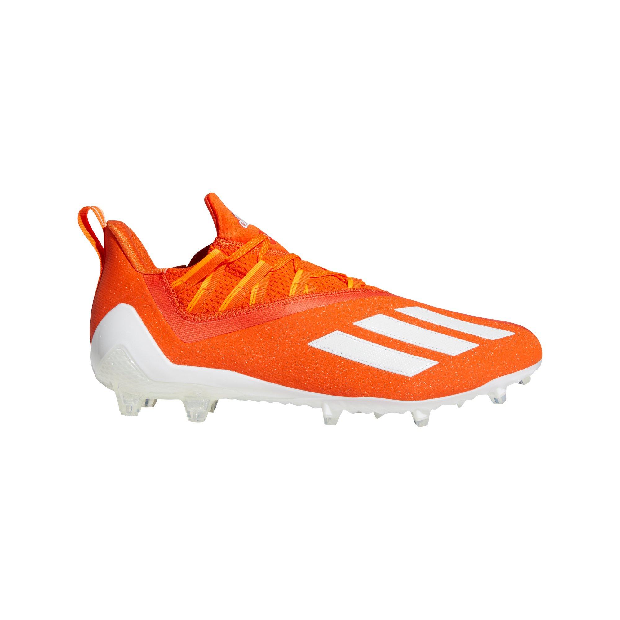 orange and white adidas football cleats