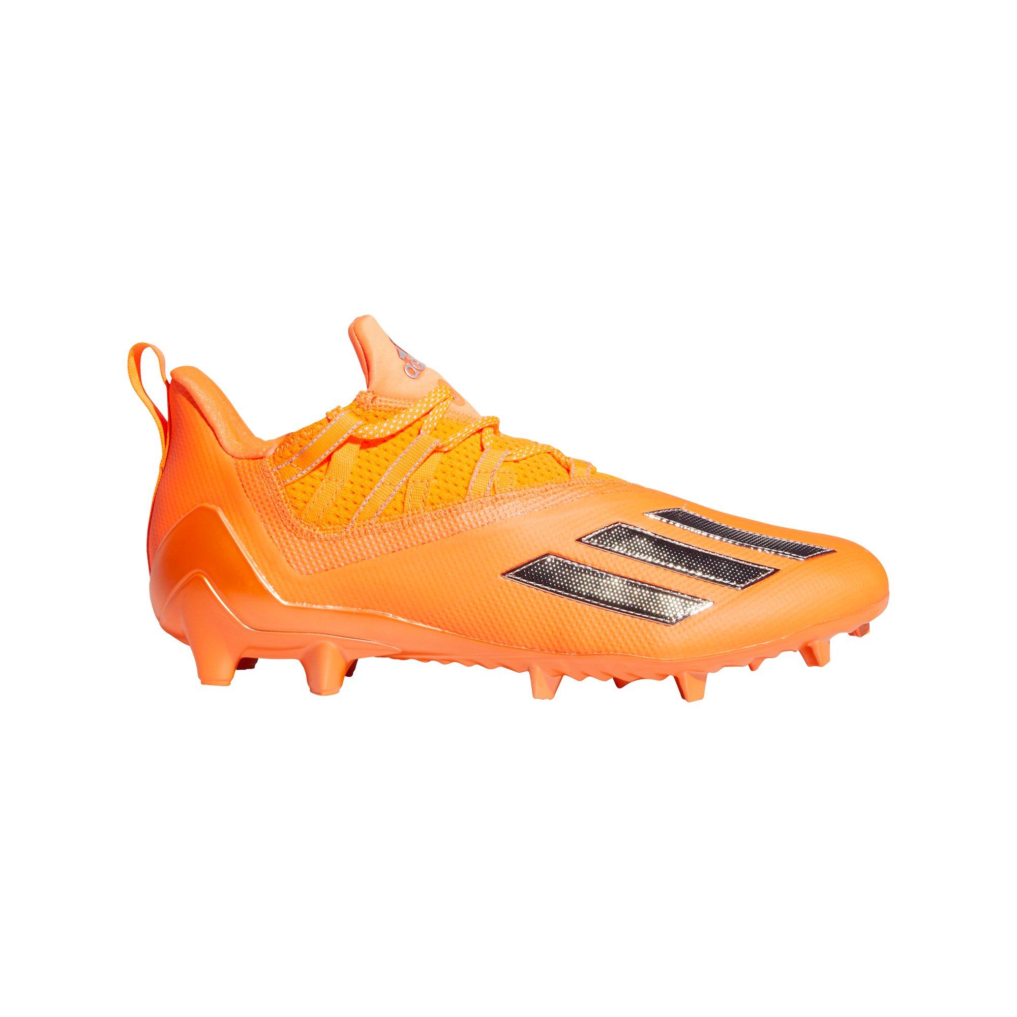 orange and black adidas football cleats