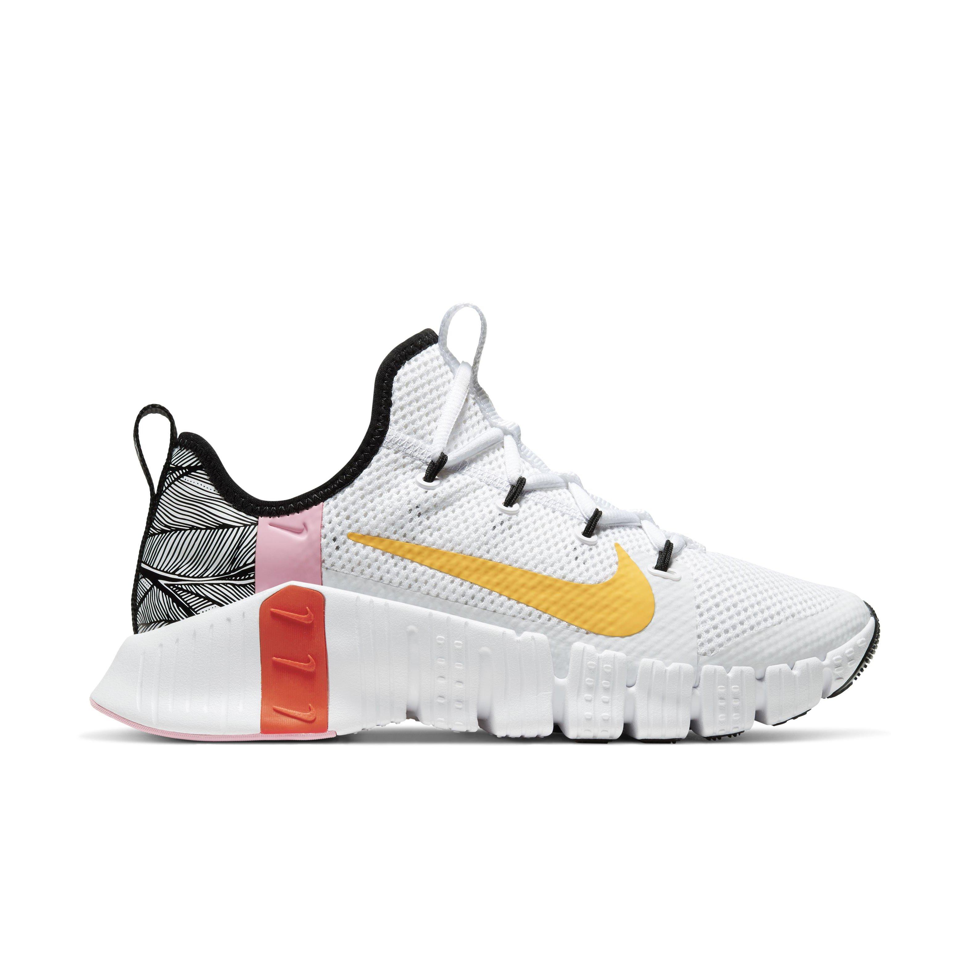 nike training metcon trainers in white and orange