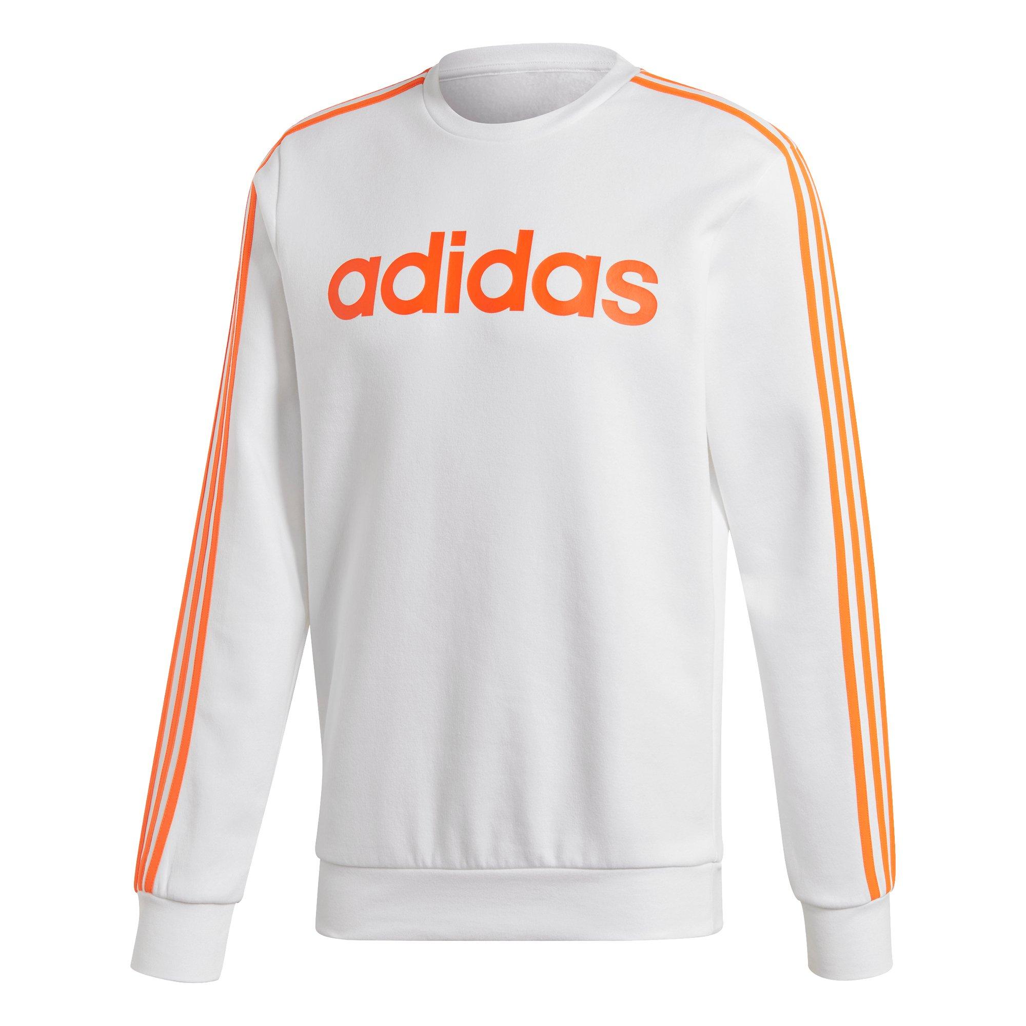 white adidas with orange stripes