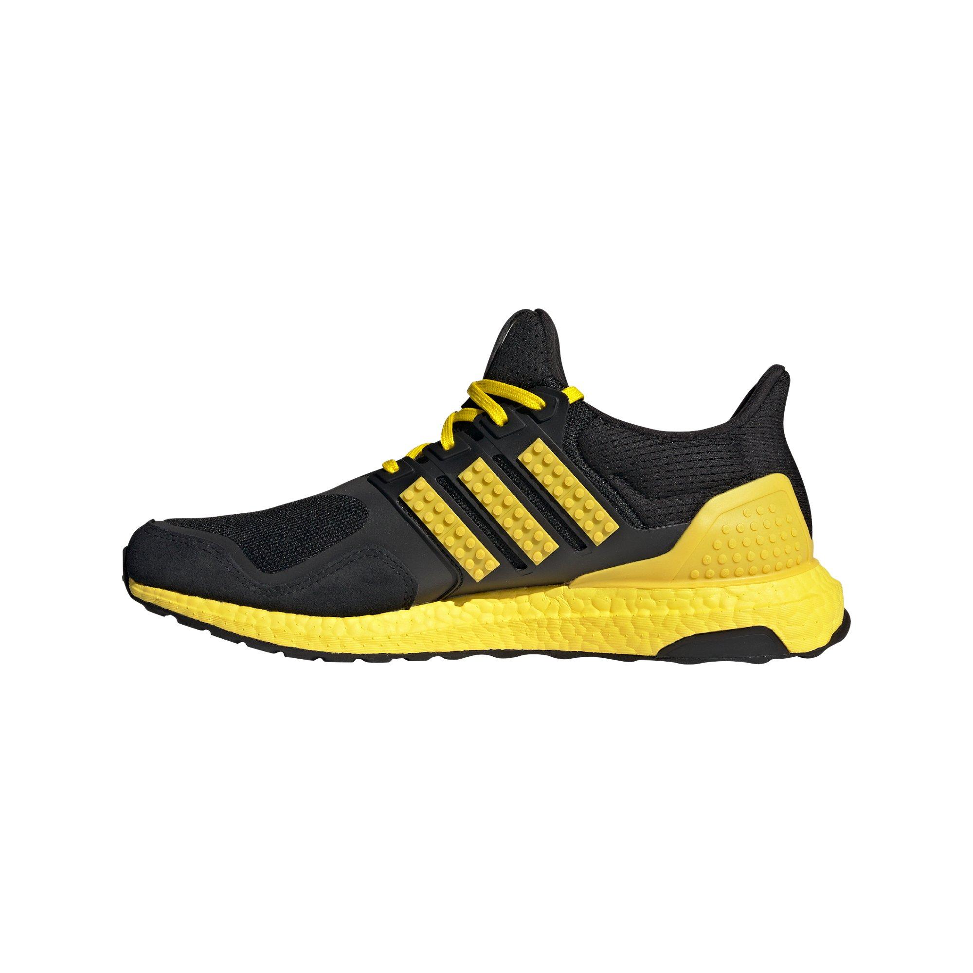 Adidas black shop and yellow shoes