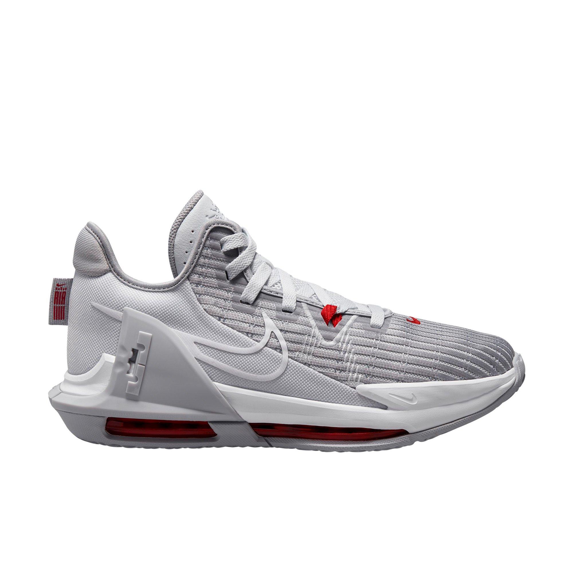 red and gray nike shoes