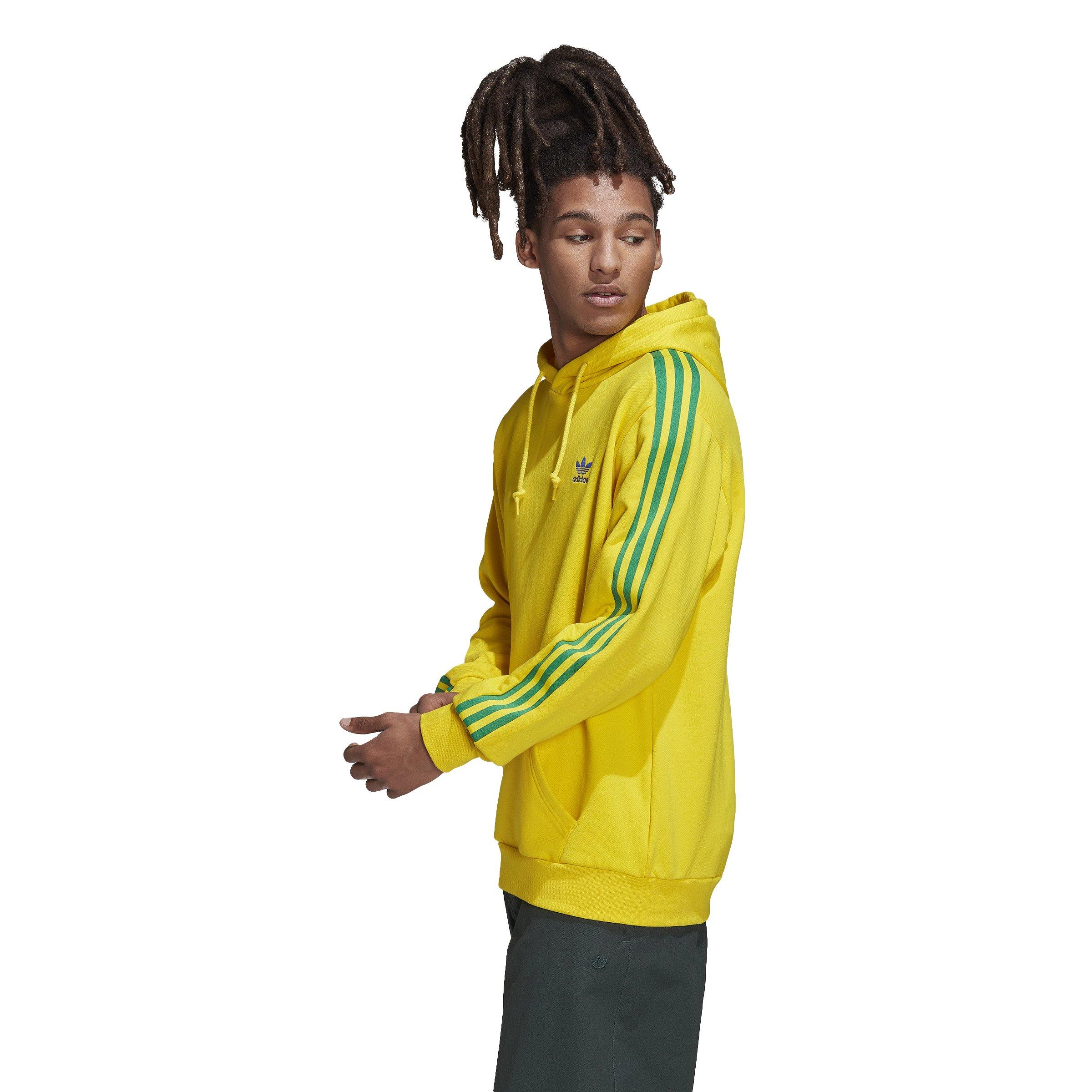 Yellow adidas hoodie with best sale black stripes