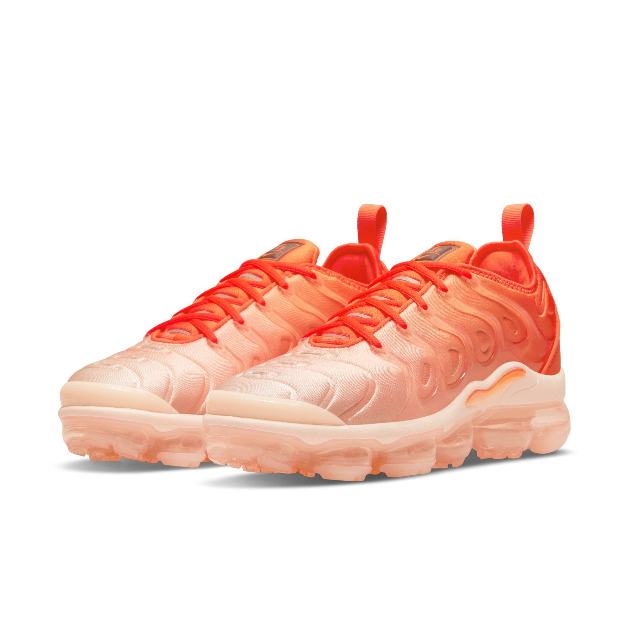 women's white and orange vapormax