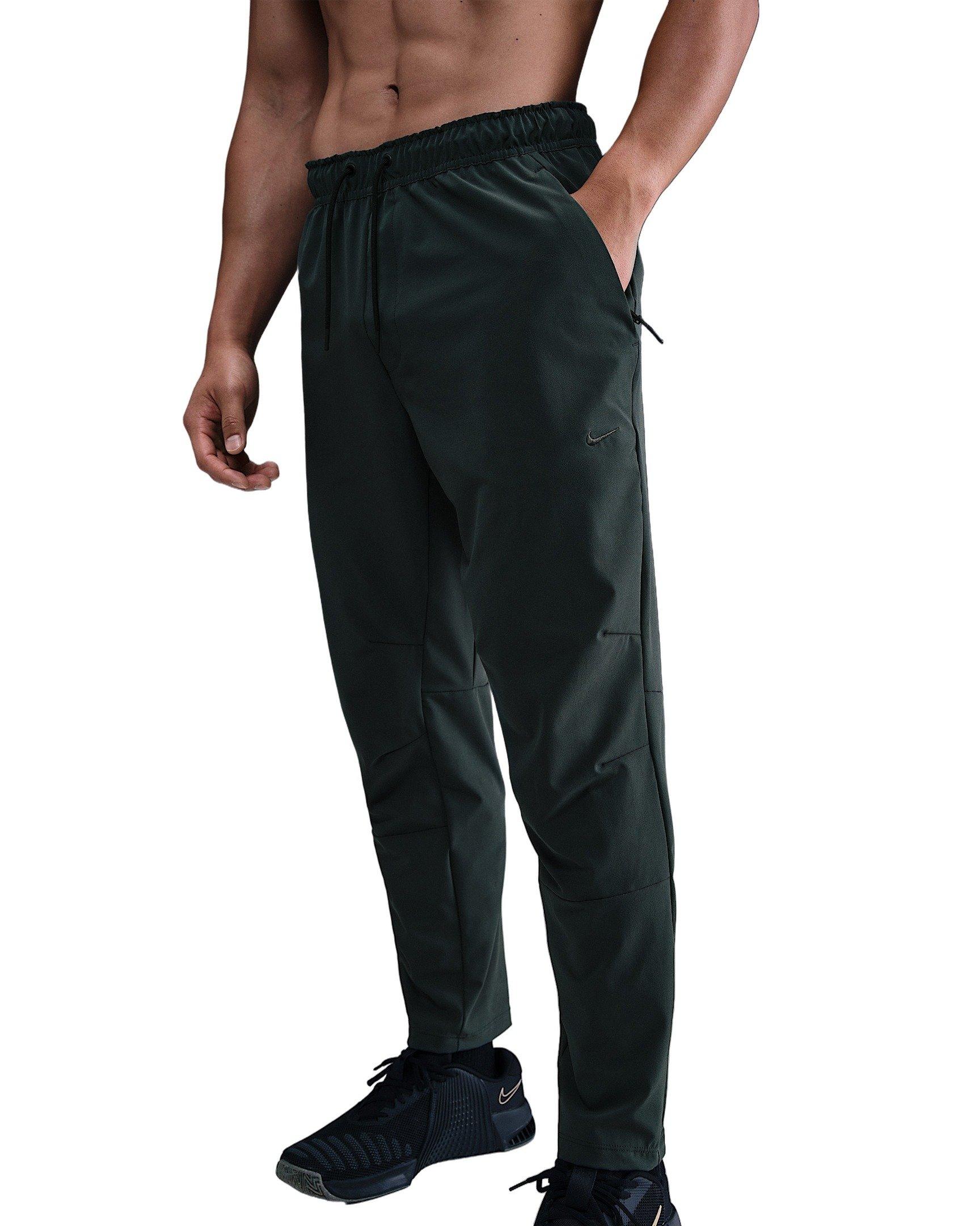 Nike Men's Unlimited Dri-FIT Tapered Leg Versatile Pants - Green - GREEN Thumbnail View 1