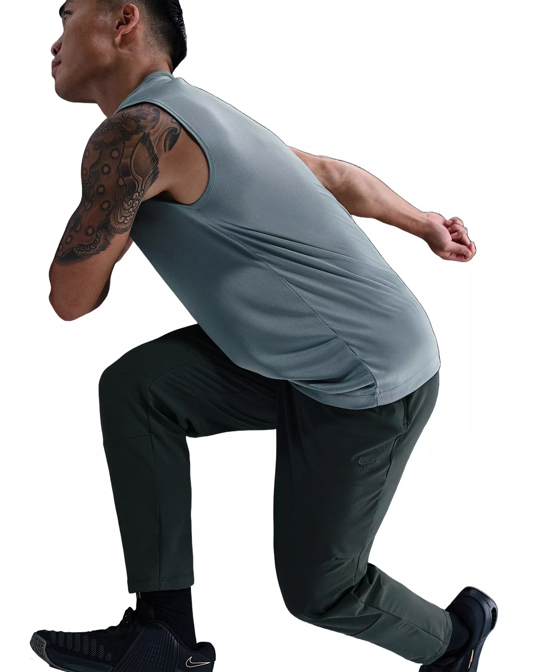 Nike Men's Unlimited Dri-FIT Tapered Leg Versatile Pants - Green - GREEN