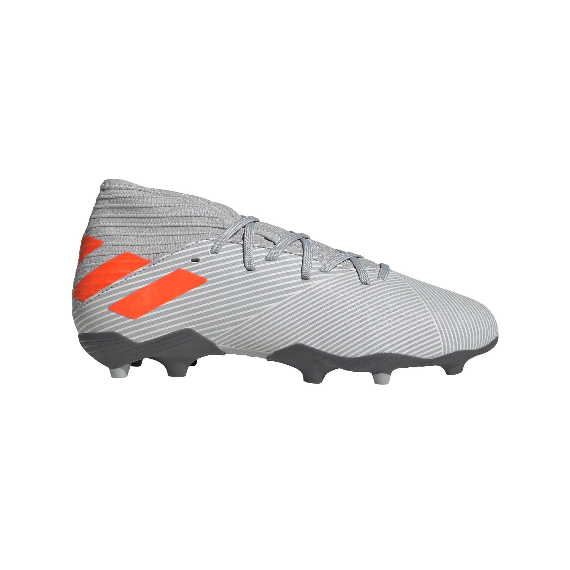 green and orange soccer cleats