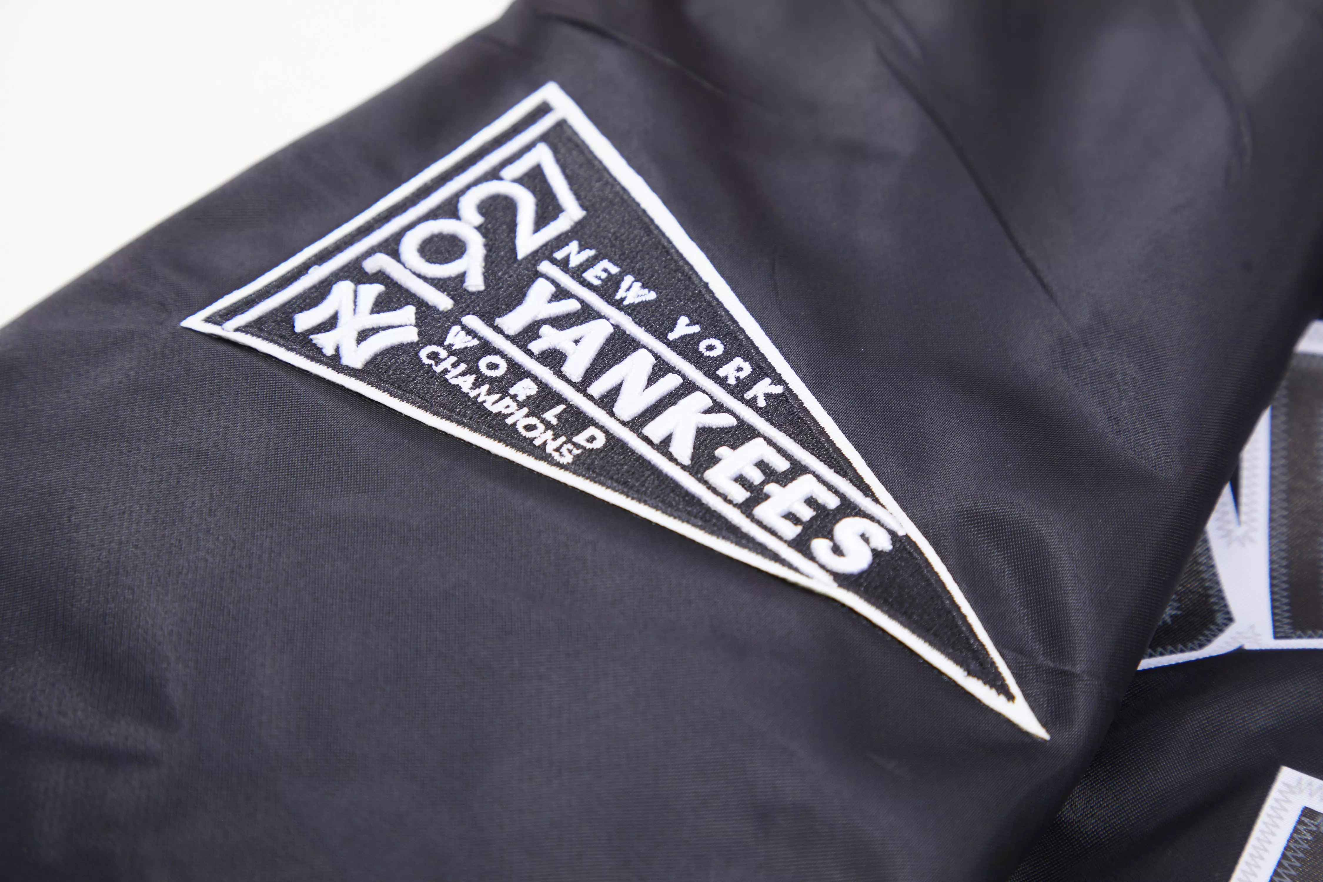 Pro Standard Men's MLB New York Yankees Murderers Row Big Logo Satin Jacket - Black - BLACK