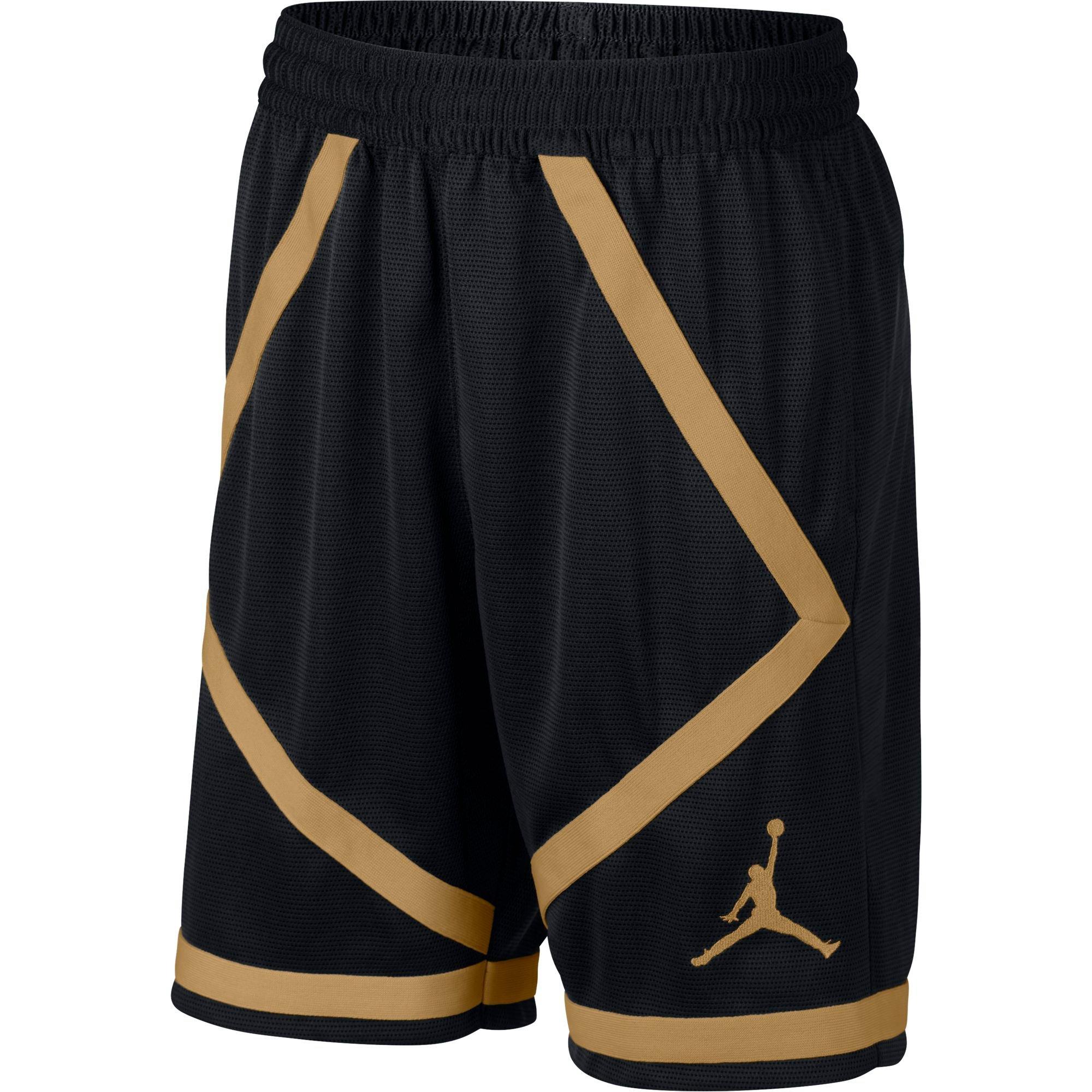 gold and black jordan shorts