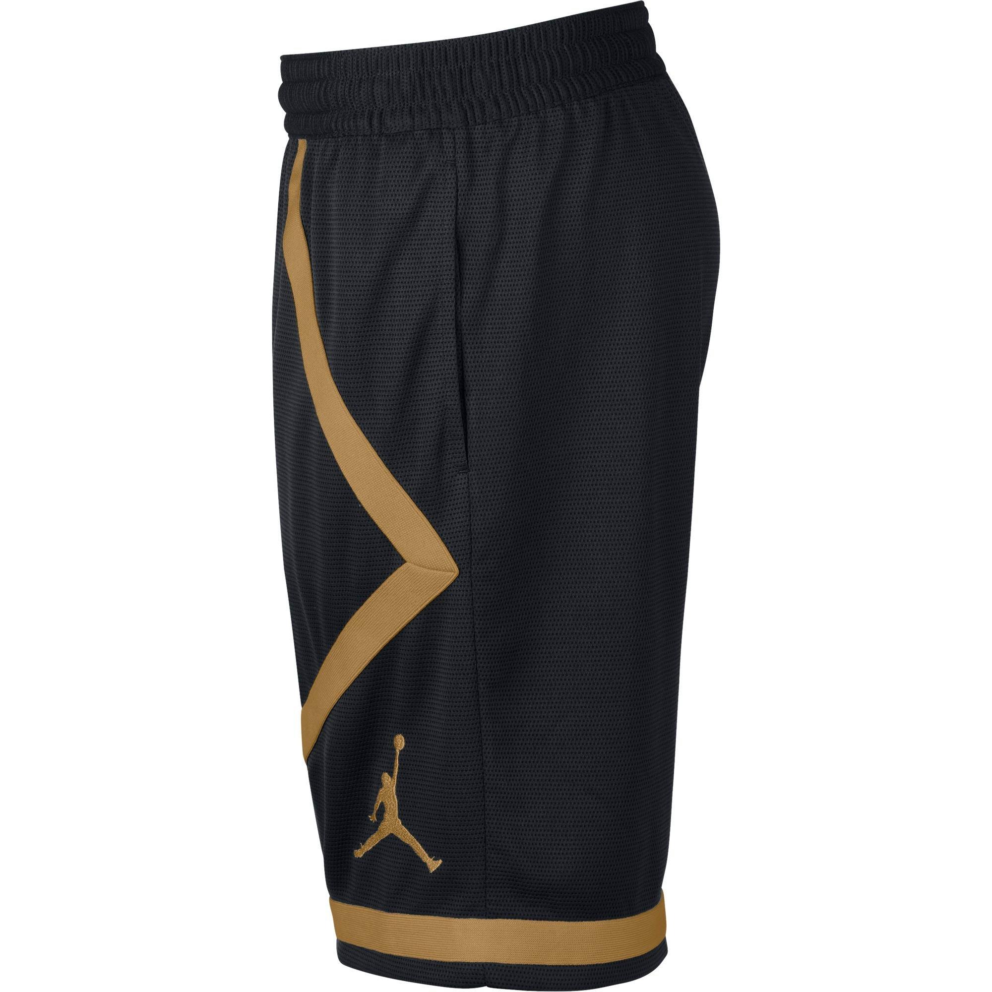 gold and black jordan shorts