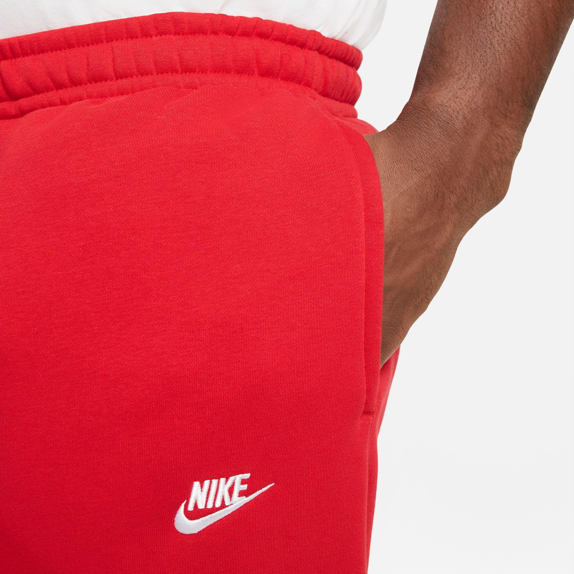 Red nike club online joggers