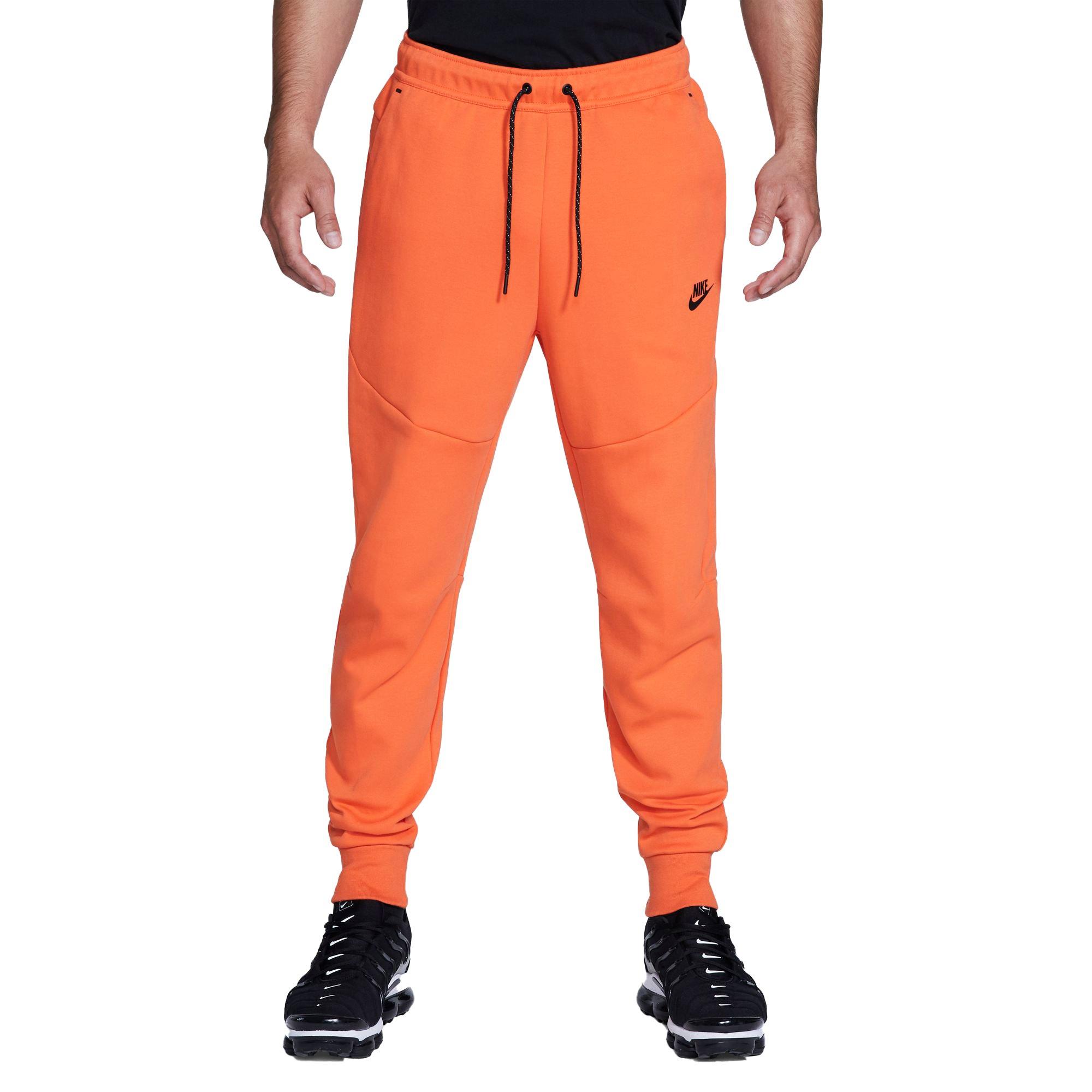 orange nike tech sweatsuit