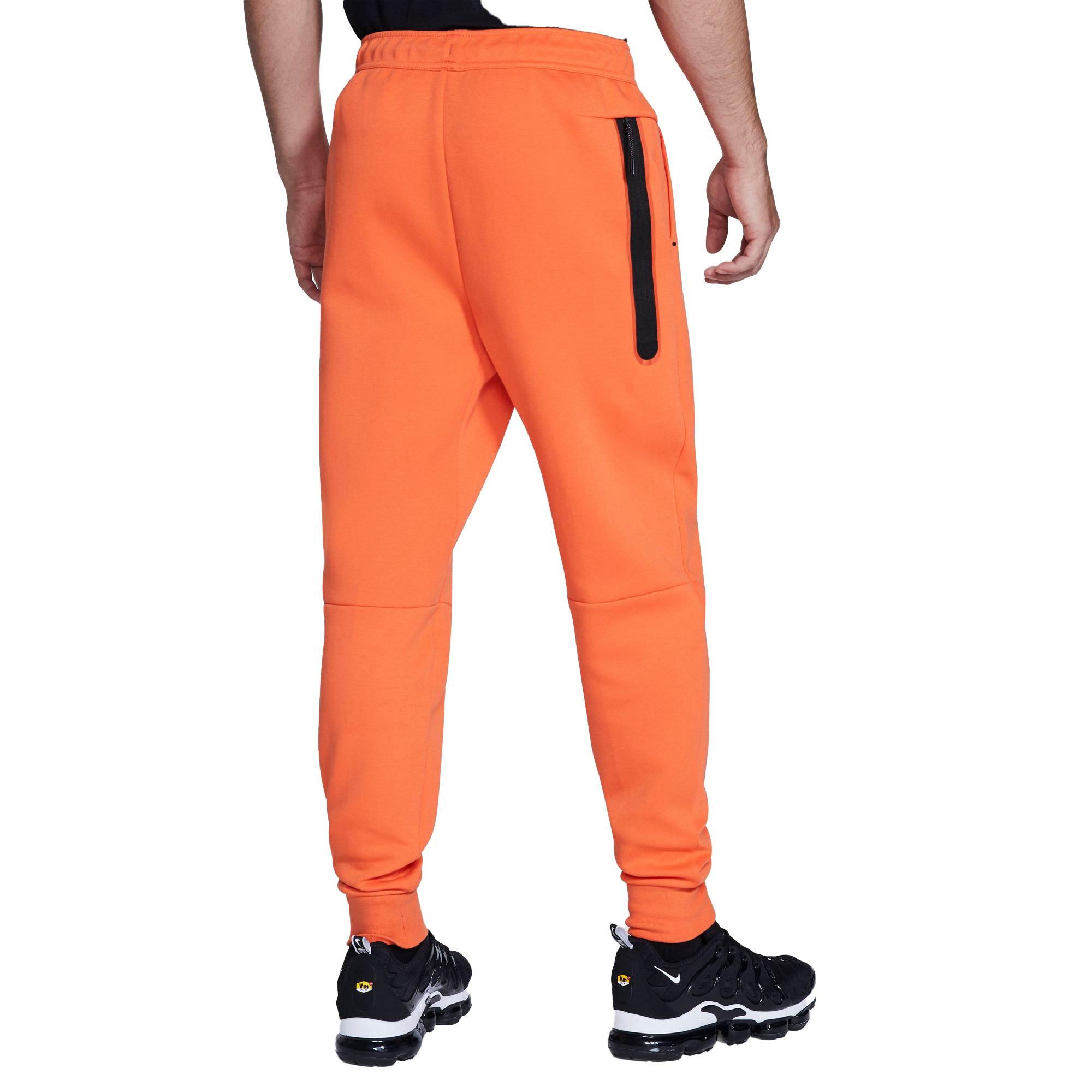 nike tech pants orange