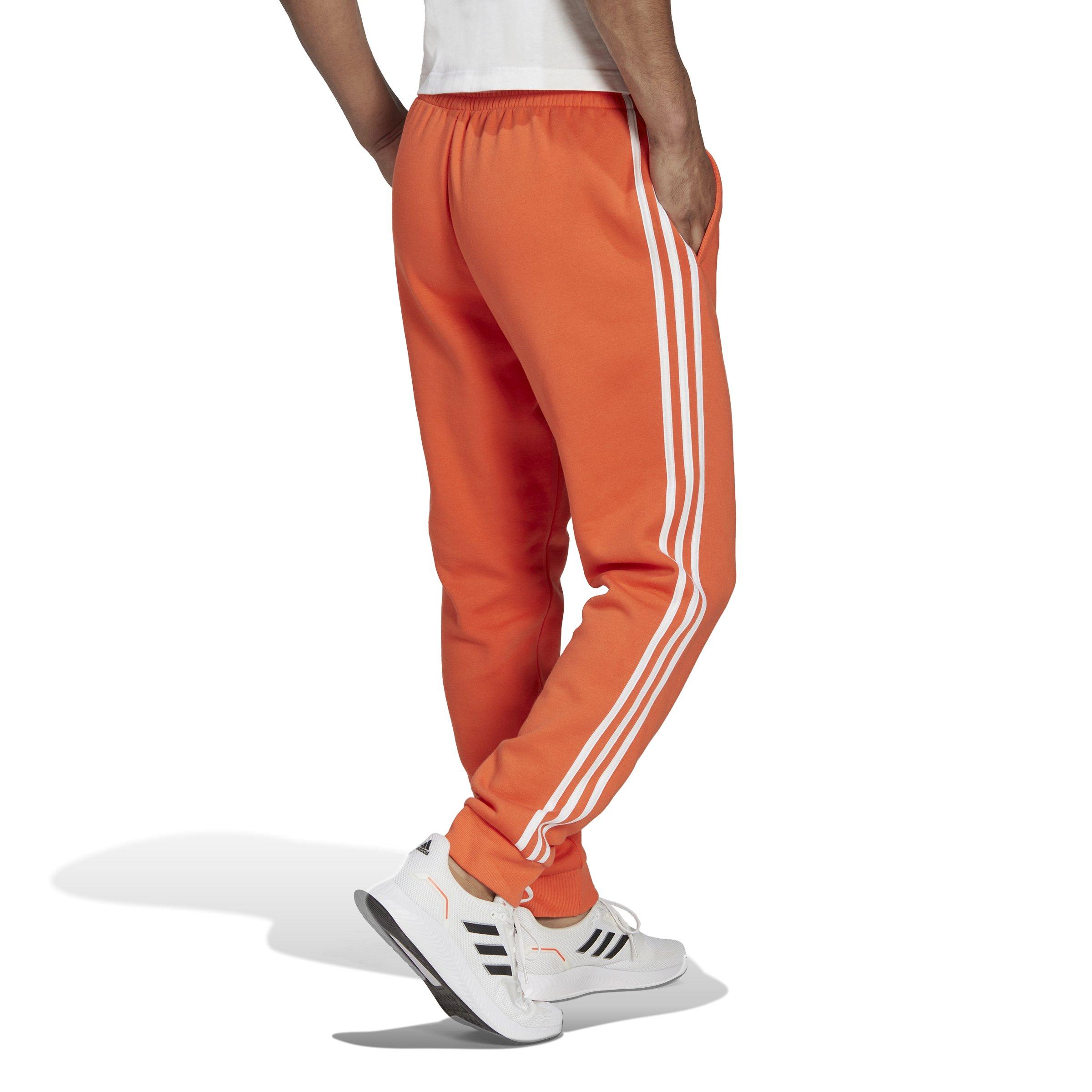 adidas Men's Essentials Tapered Cuff 3-Stripes Joggers-Orange