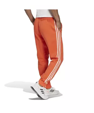 Belegering Reductor eerste adidas Men's Essentials Fleece Tapered Cuff 3-Stripes Joggers-Orange