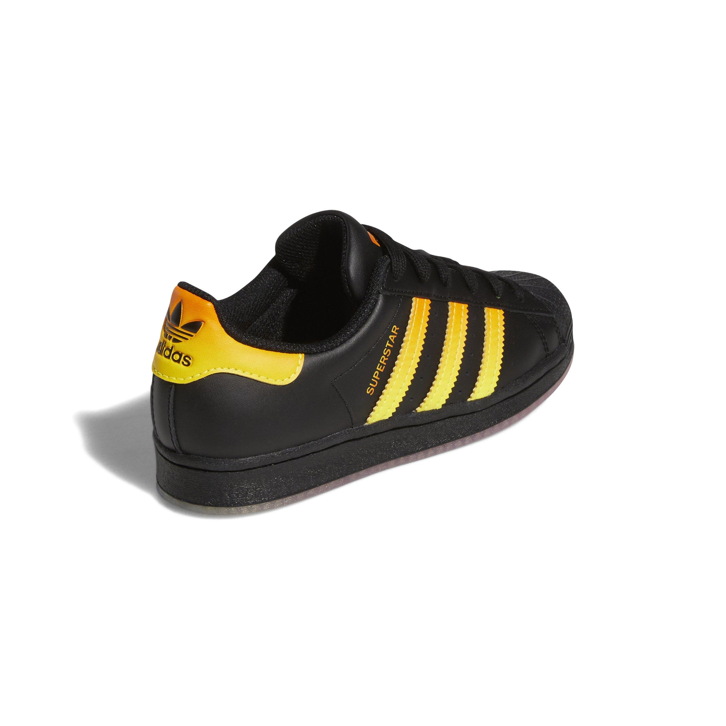 Adidas superstar black on sale orange