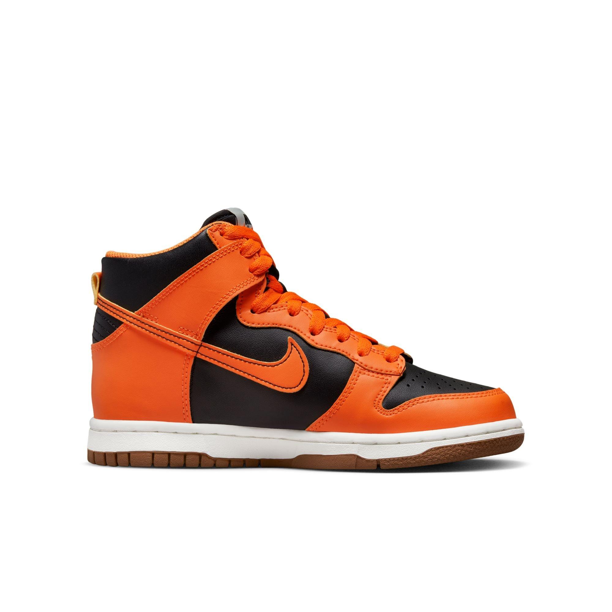 Black and orange 2025 high top nikes