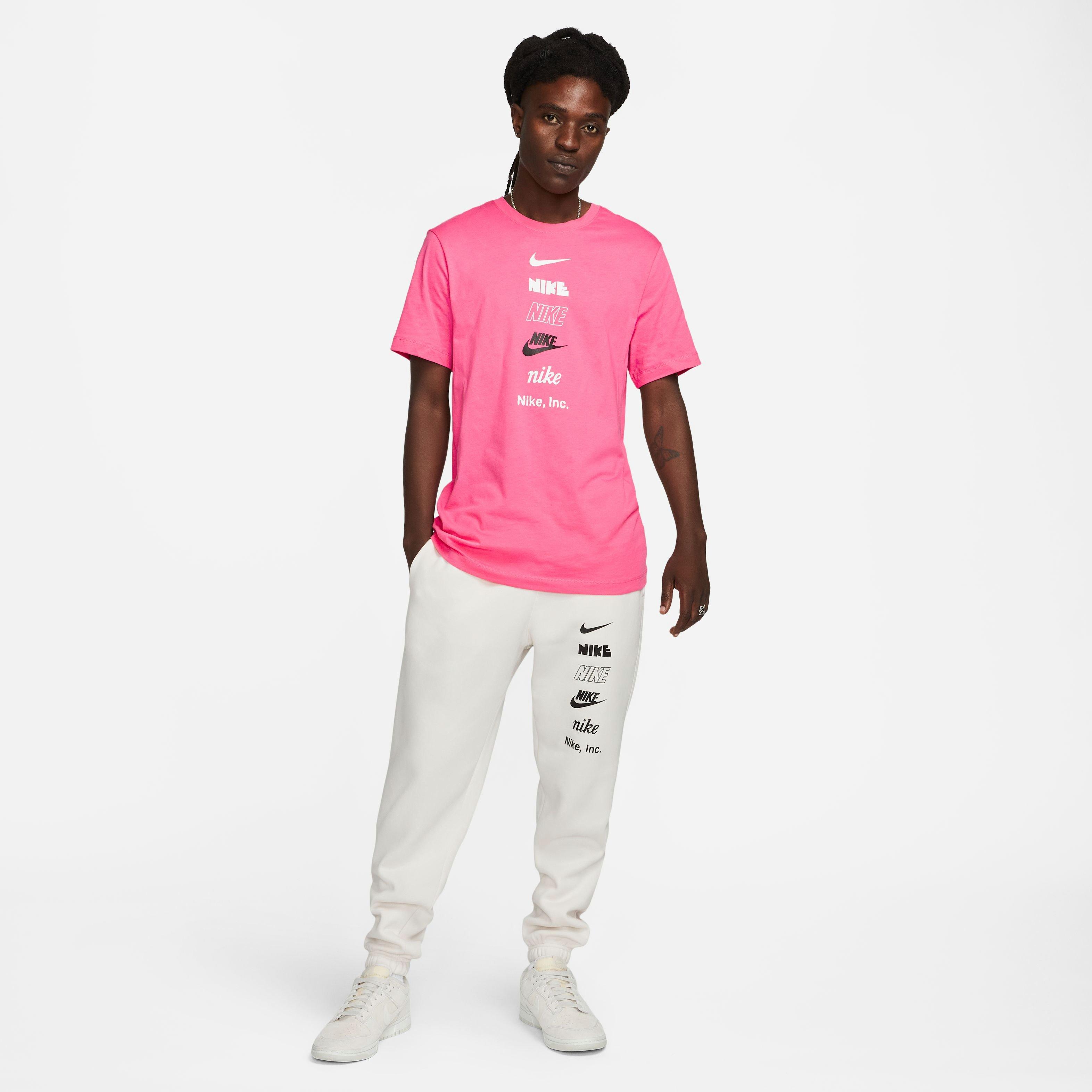 White nike shirt shop with pink logo