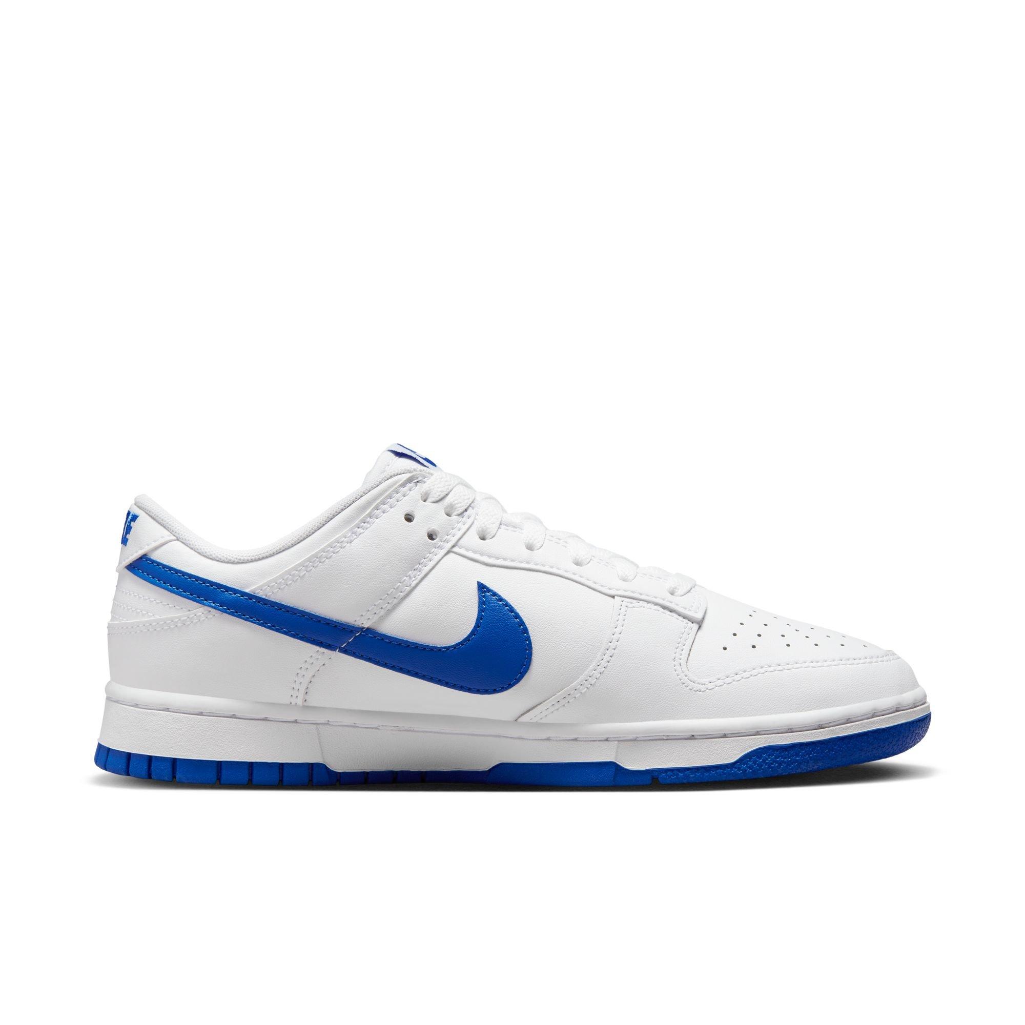 White nikes store with blue swoosh