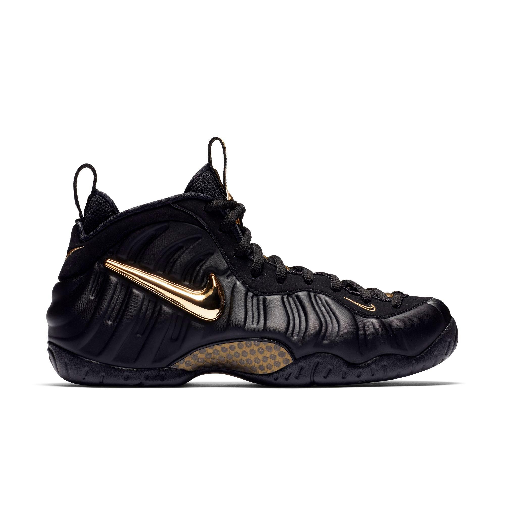 gold and black nike foams