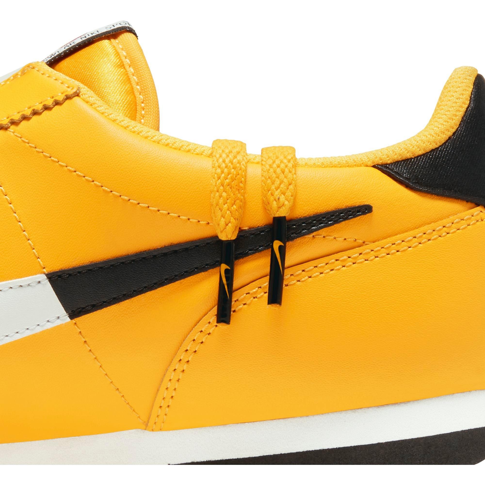nike cortez yellow and black