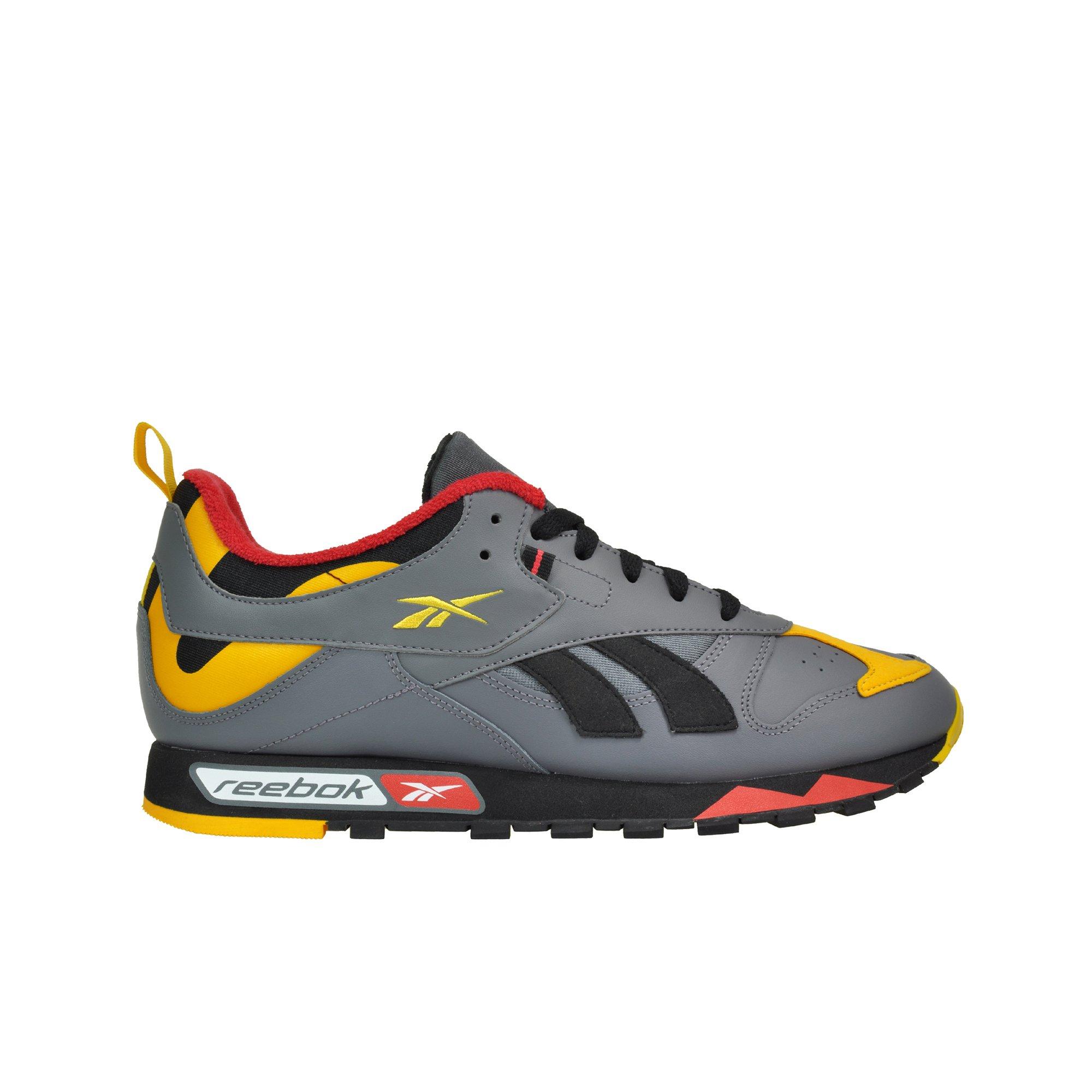black and yellow reebok shoes