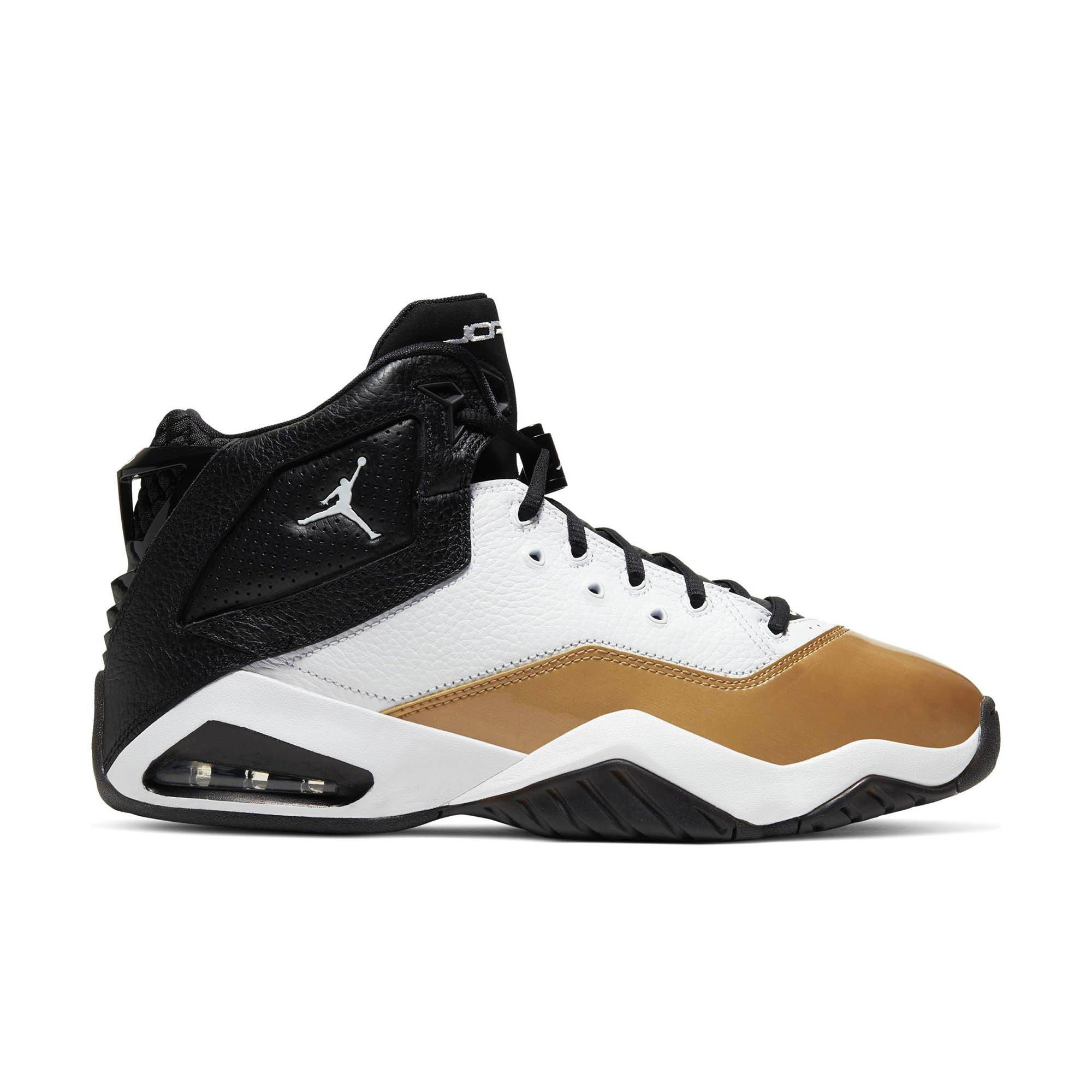 gold and black and white jordans