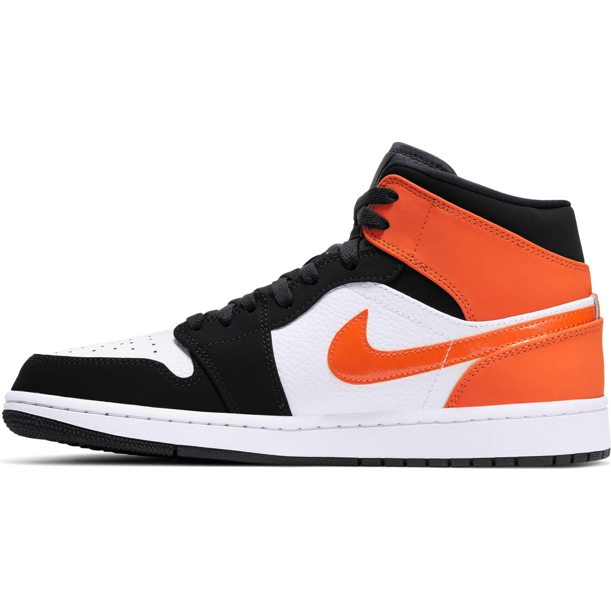 orange black and white air jordan 1s