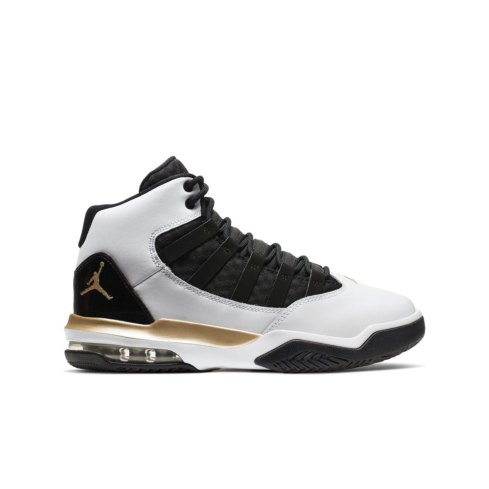 gold and black and white jordans