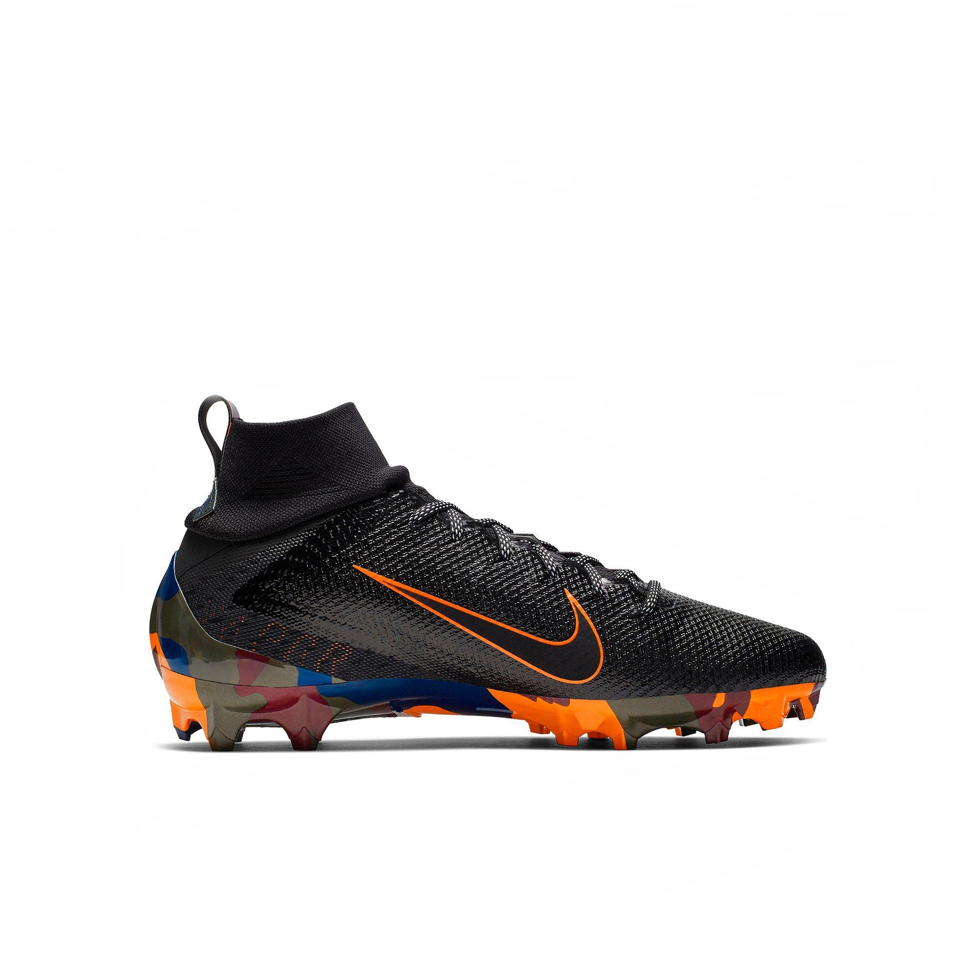 orange and black football cleats youth