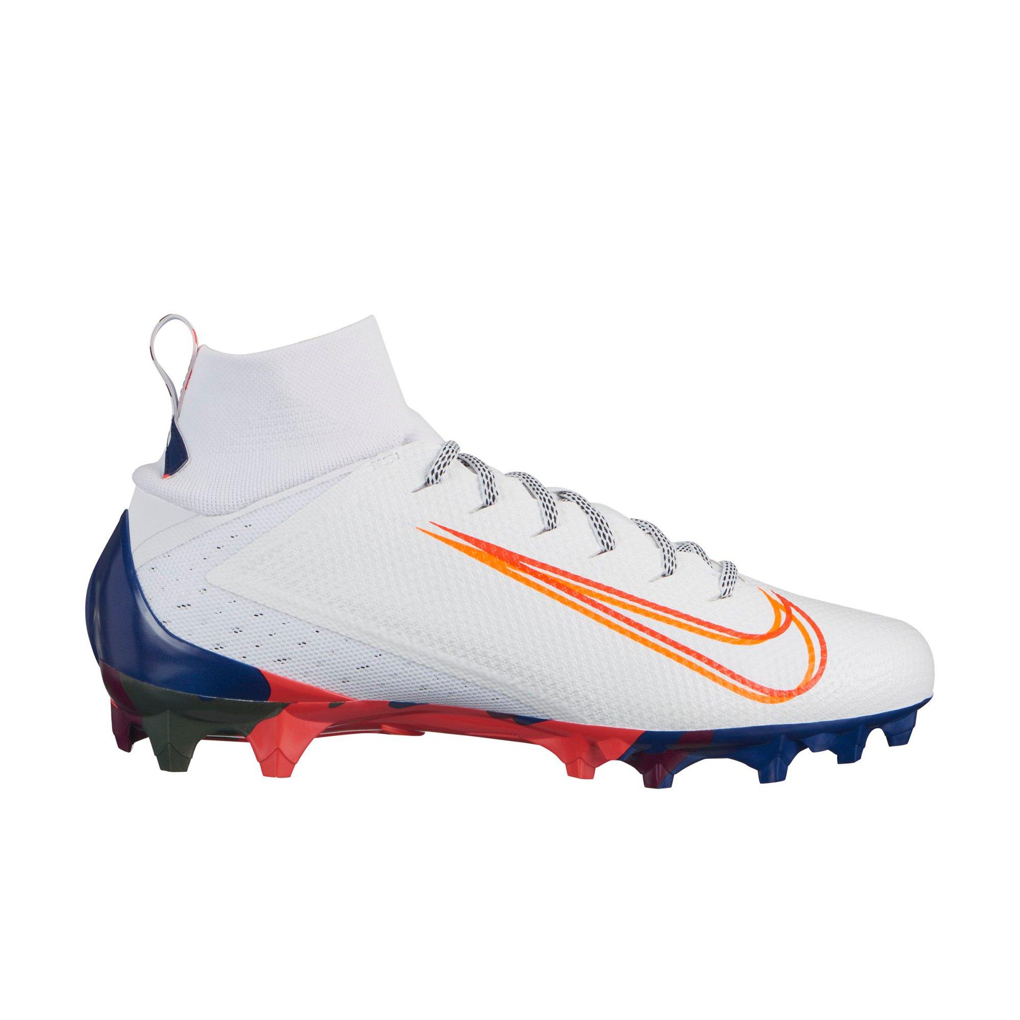 white and orange football cleats