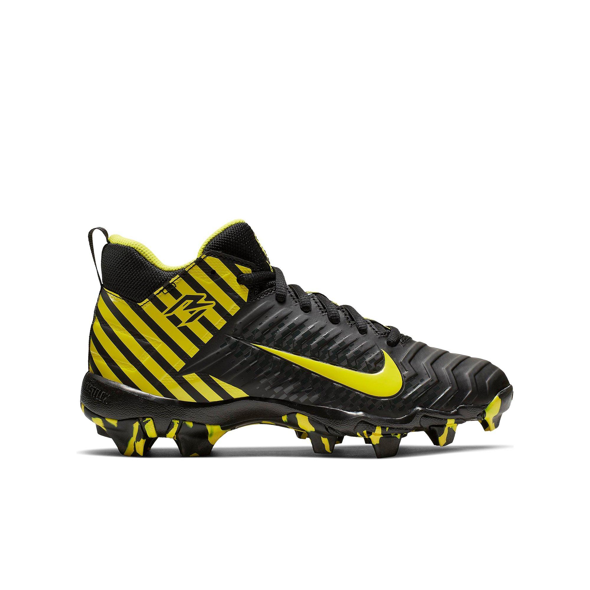black and yellow nike football cleats