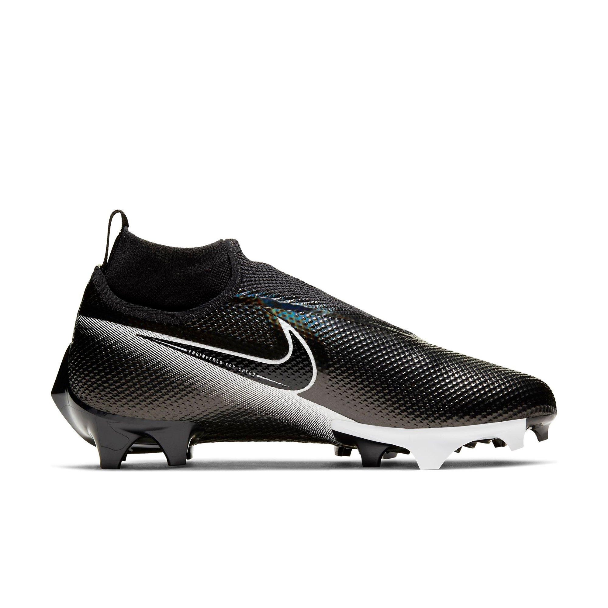 white and black nike cleats